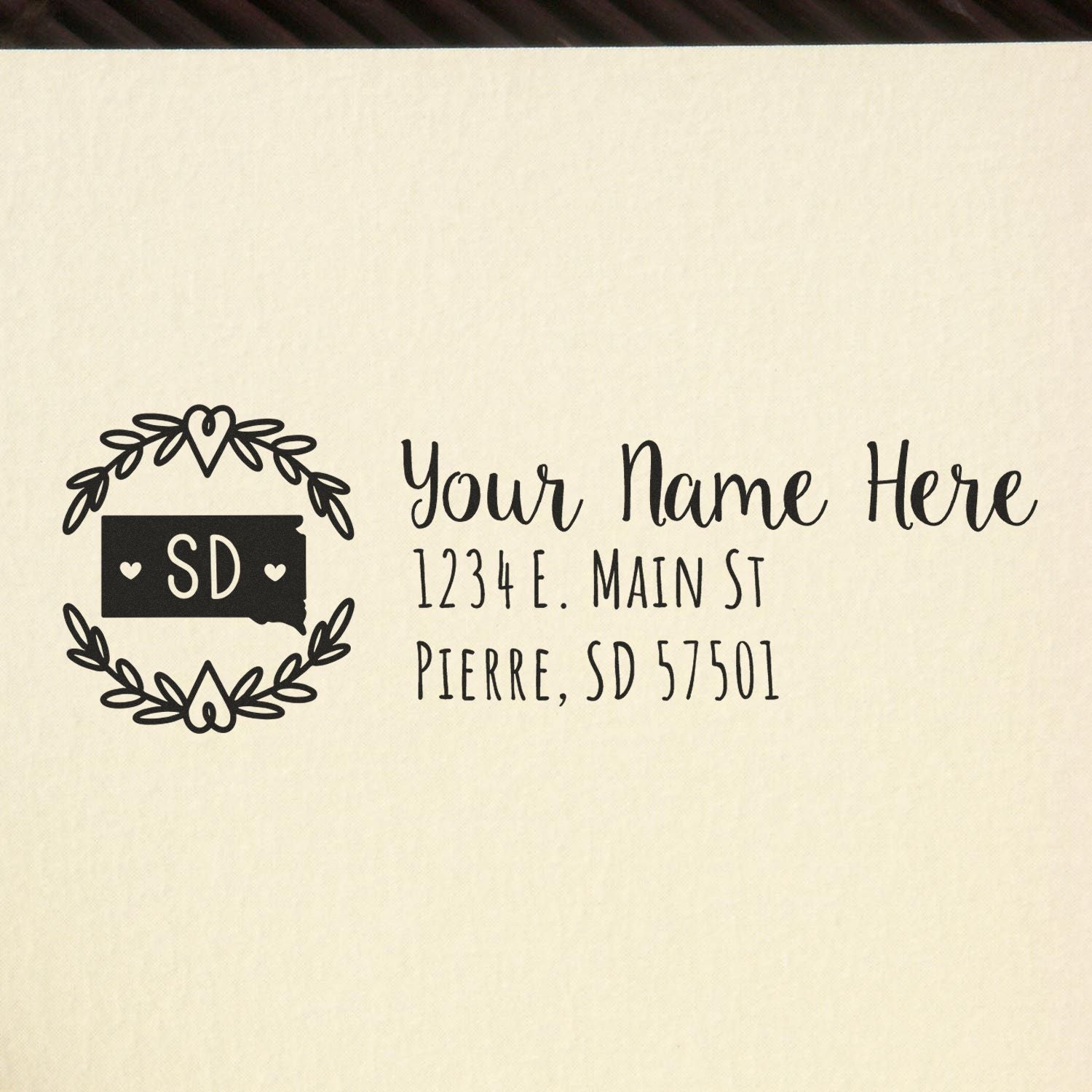 South Dakota State Custom Return Address Stamp featuring a heart-accented state outline and personalized address text on a beige background. Perfect for adding a personal touch to your mail.