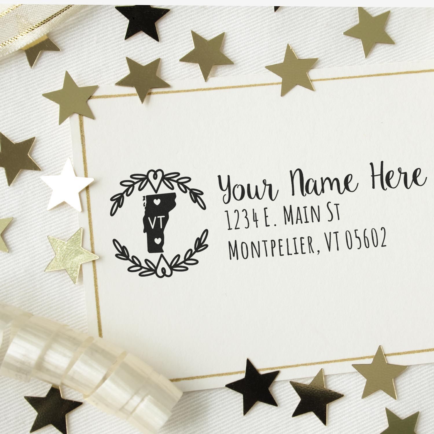 Vermont State Custom Return Address Stamp on a card with gold stars and ribbon. Features a Vermont outline with VT inside, surrounded by a wreath, and sample address text.