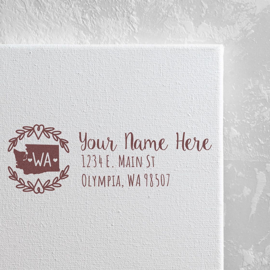 Washington State Custom Return Address Stamp on white paper, featuring a decorative state outline with WA and placeholder text for name and address in elegant font.