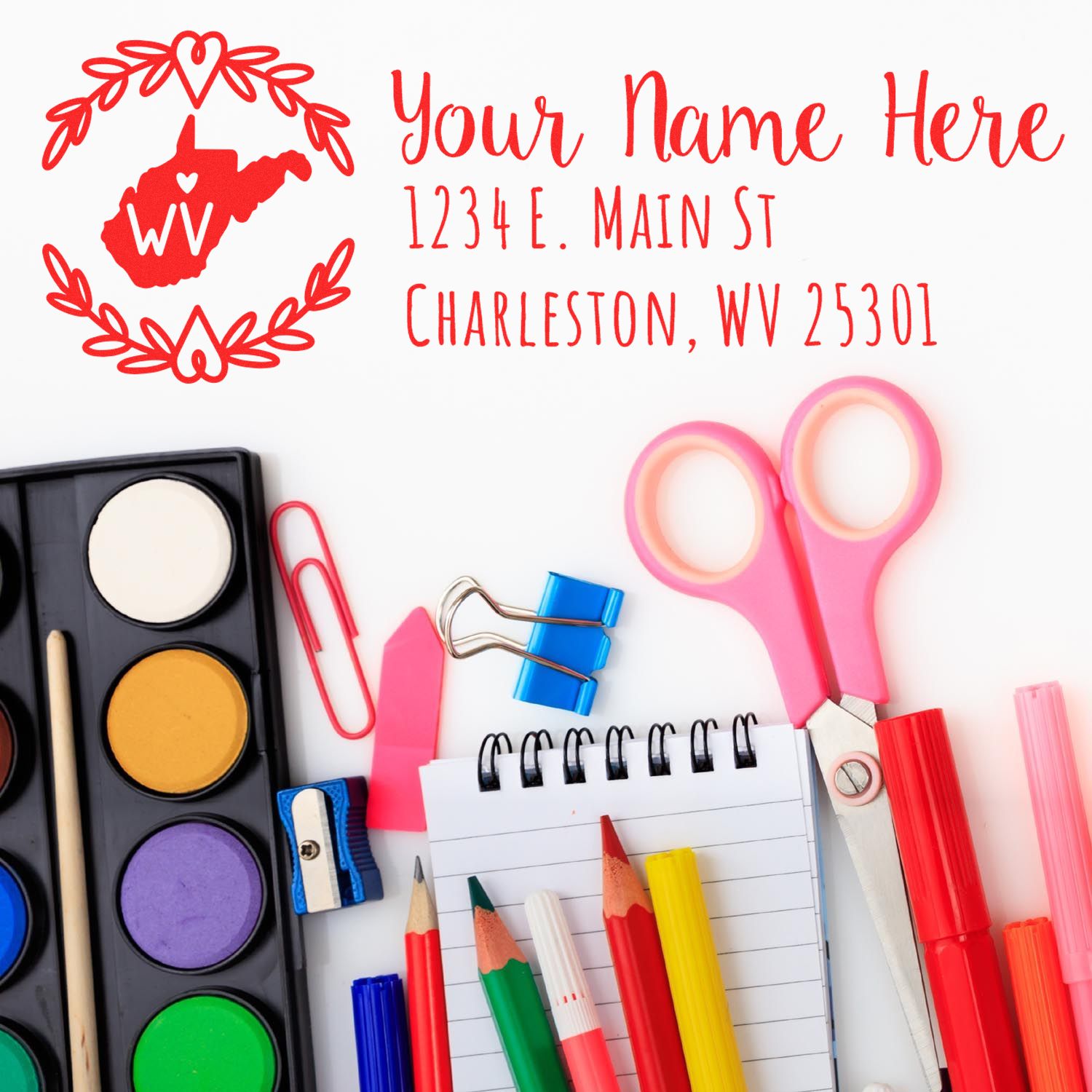 West Virginia State Custom Return Address Stamp displayed with art supplies, including paints, scissors, and colored pencils, on a white background.