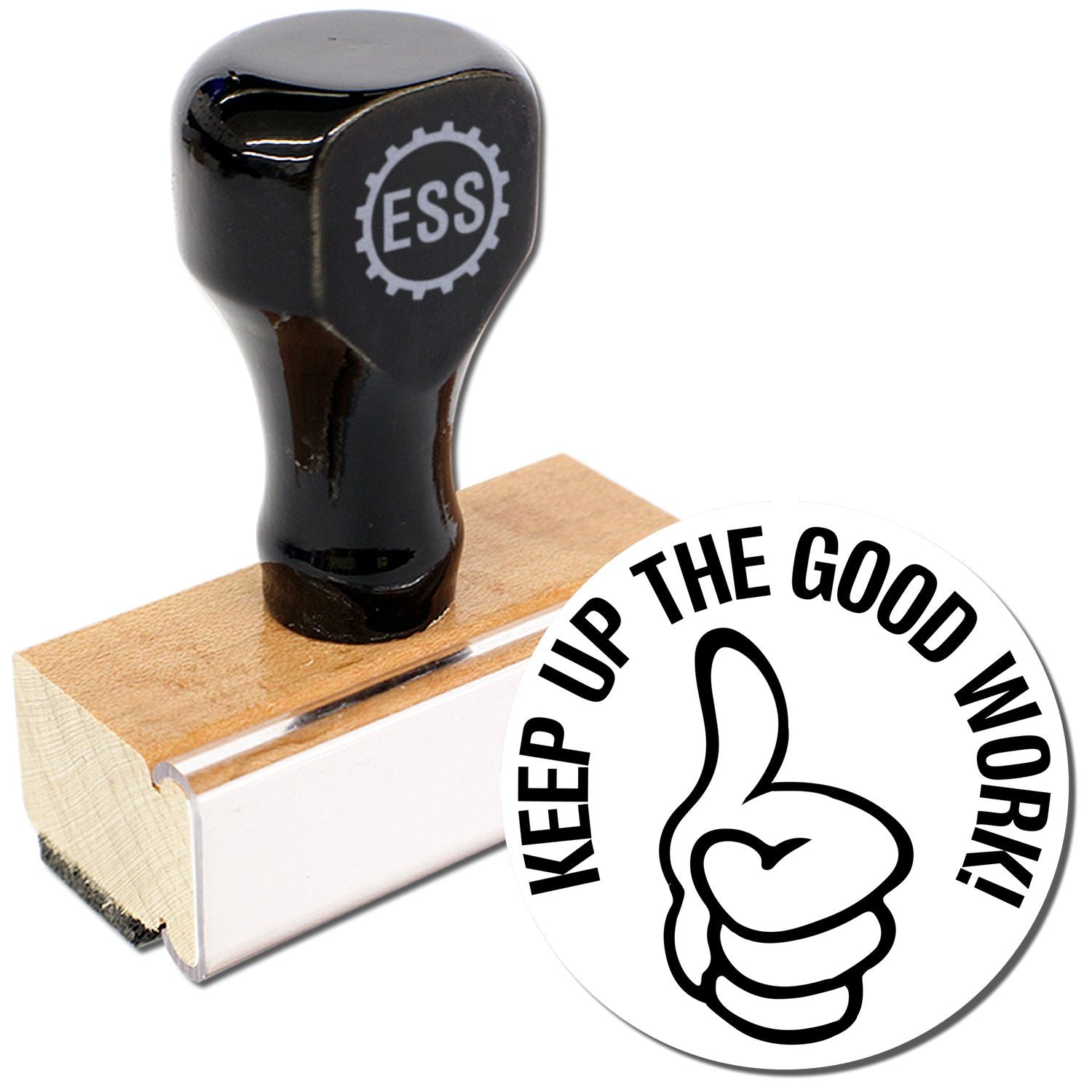 A stock office rubber stamp with a stamped image showing how the text KEEP UP THE GOOD WORK in a round shape with a thumbs-up symbol is displayed after stamping from it.