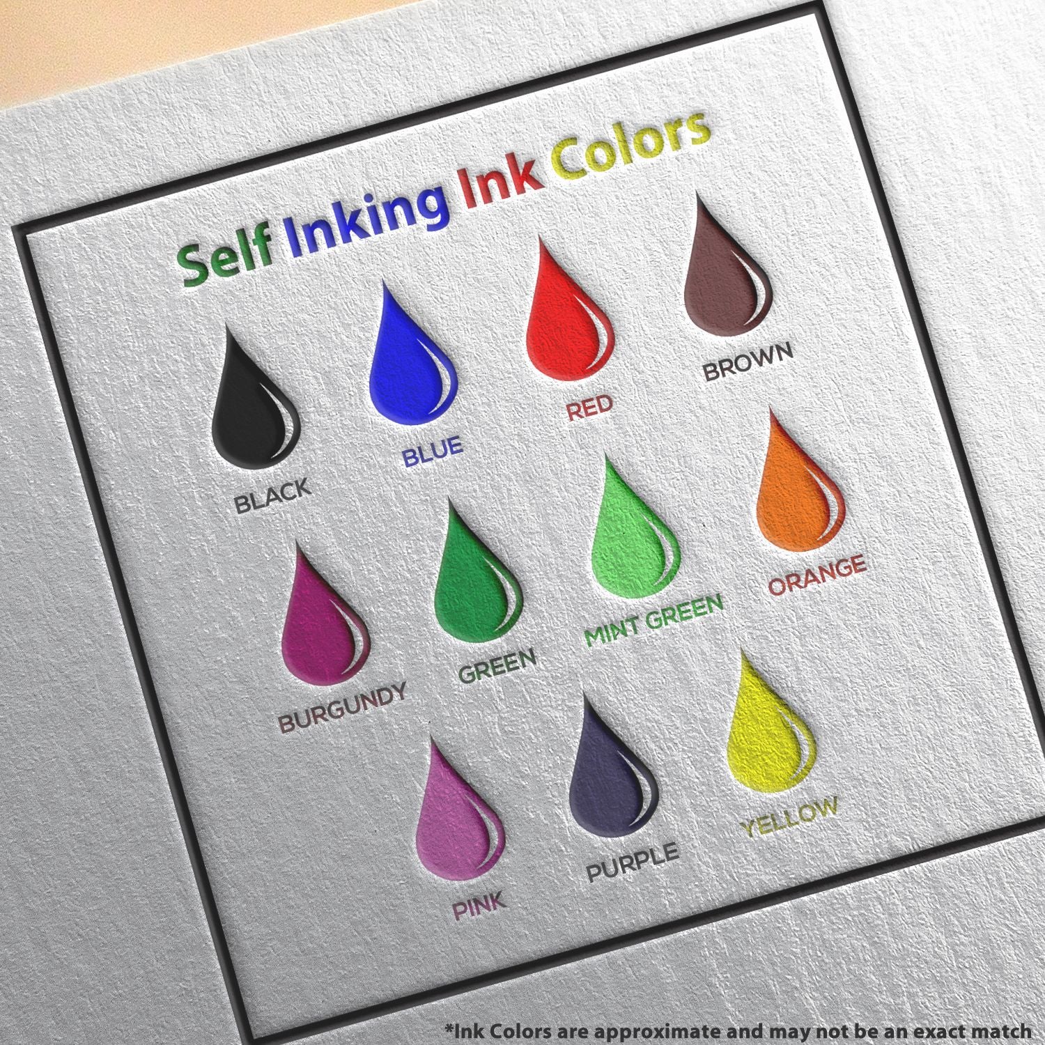 Image of a Self-Inking Happy Face Smiley Stamp with various ink colors: black, blue, red, brown, burgundy, green, mint green, orange, pink, purple, and yellow.