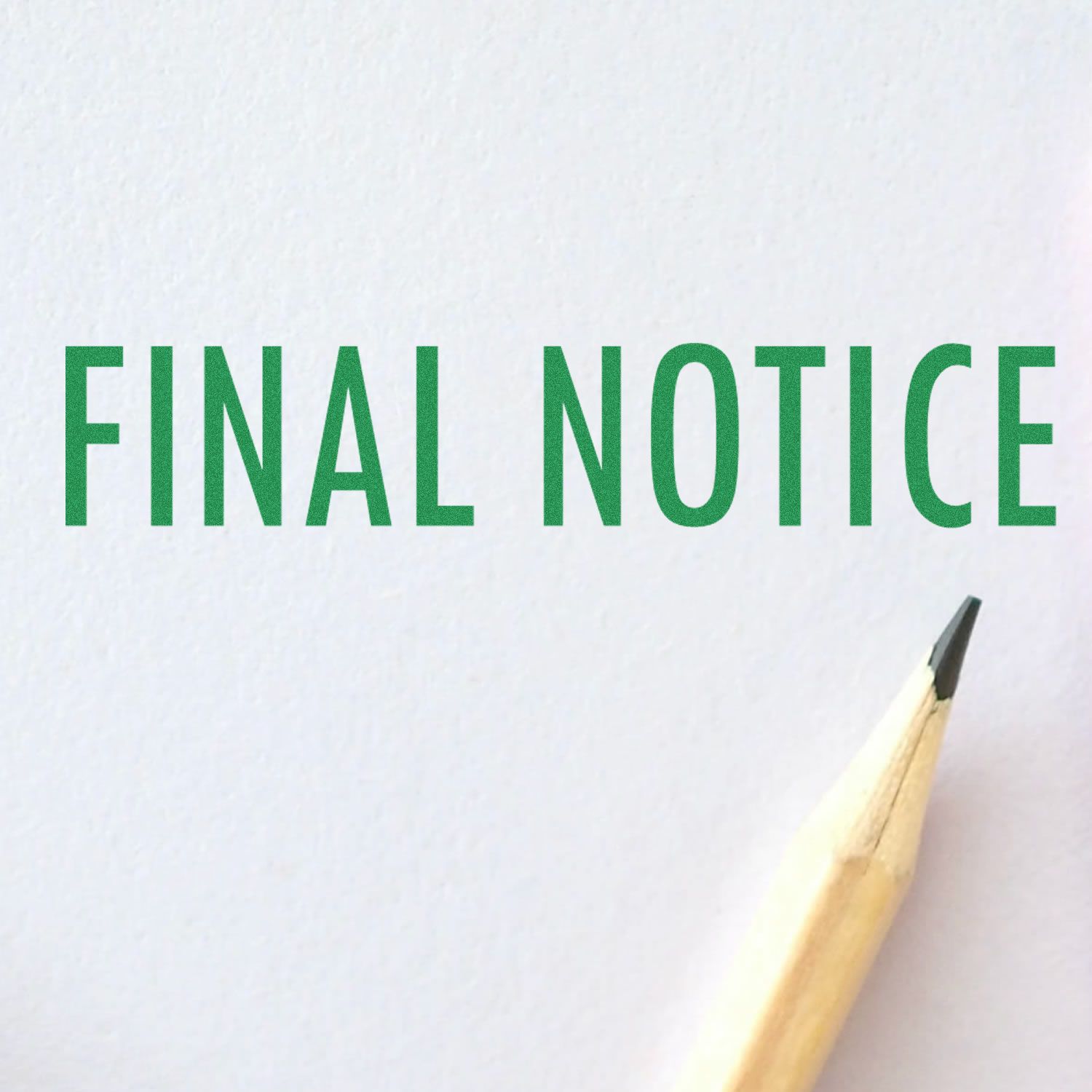 Image of a Large Pre-Inked Final Notice Stamp impression in green ink on white paper, with a sharpened pencil tip visible at the bottom right.