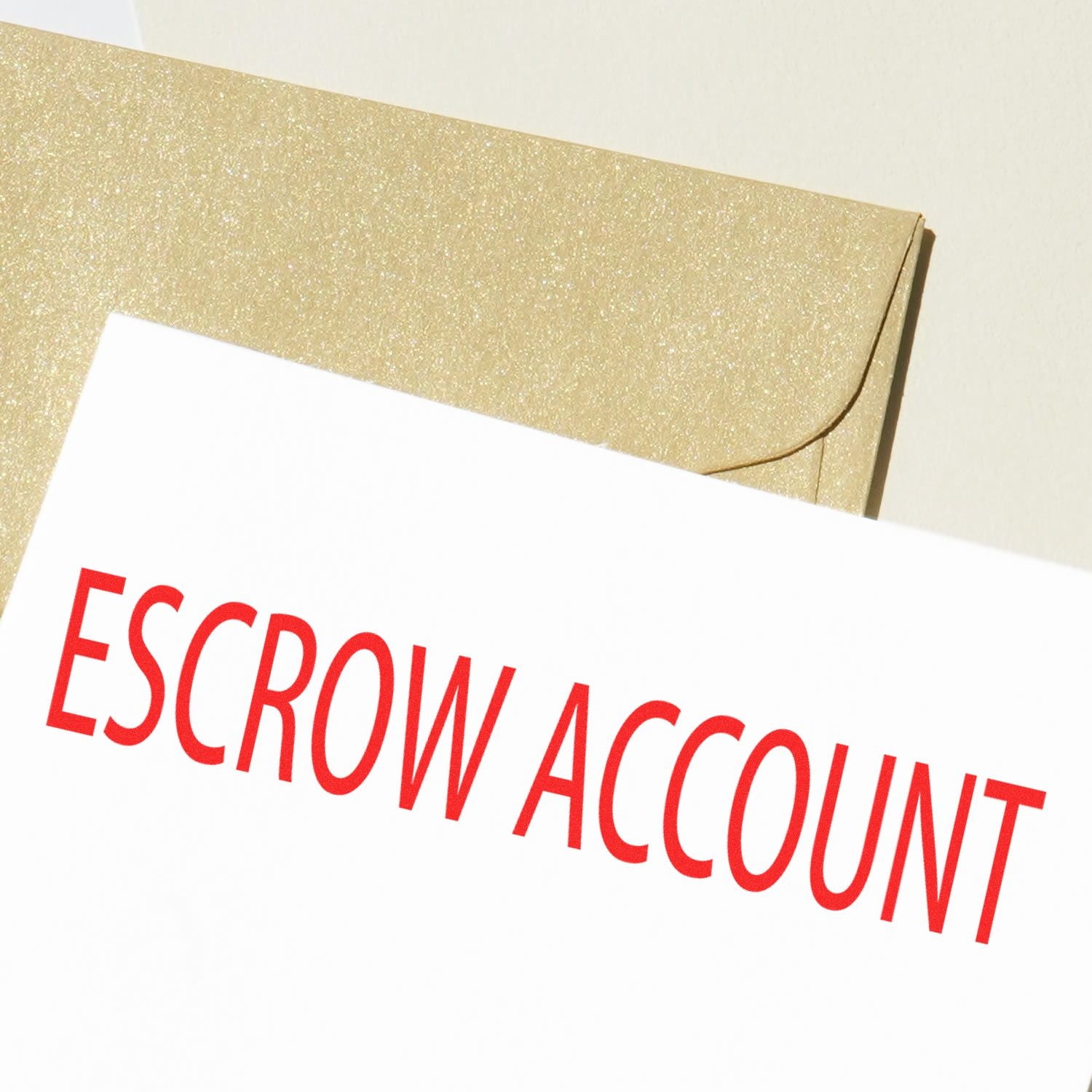 A document stamped with ESCROW ACCOUNT in red ink, using the Large Pre-Inked Escrow Account Stamp, placed on a beige envelope.