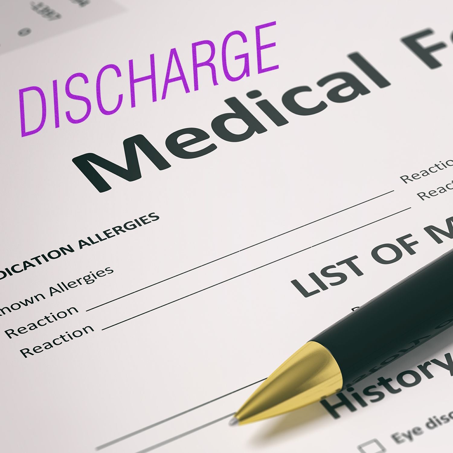 A medical form stamped with DISCHARGE using the Large Pre-Inked Discharge Stamp, with a pen placed on the form.