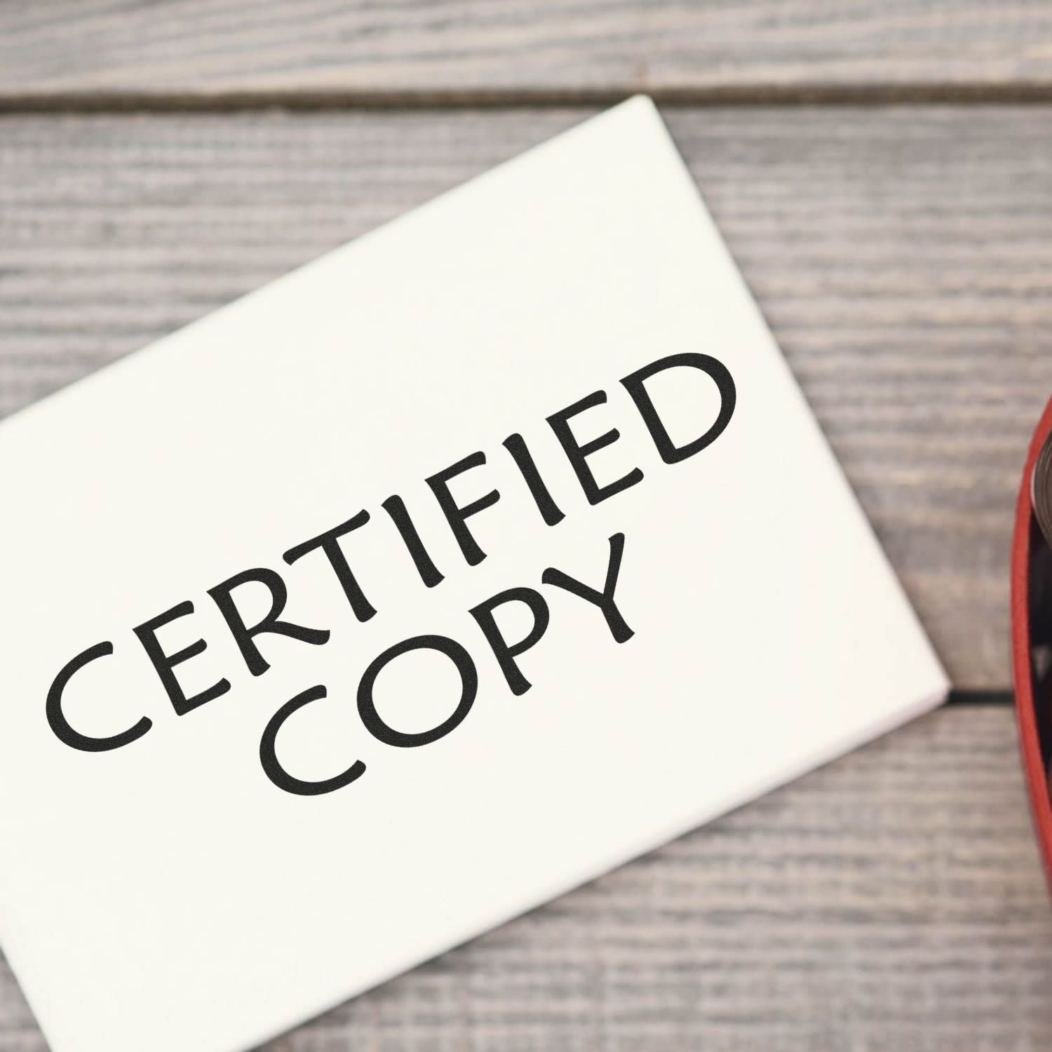 Large Pre-Inked Certified Copy Stamp on a wooden surface, with the stamp showing the text CERTIFIED COPY in bold black letters.