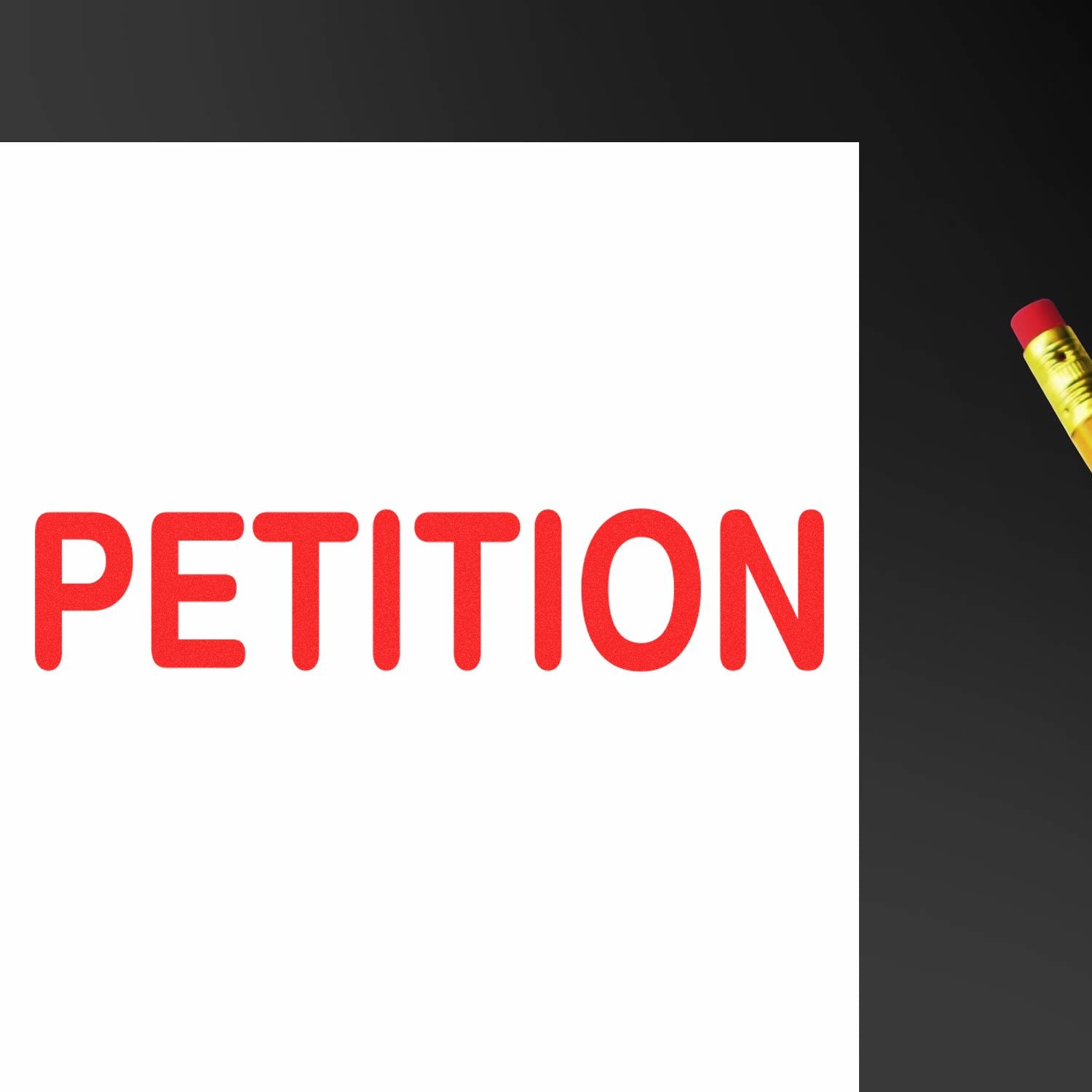 Image of a Large Pre-Inked Petition Stamp imprinting the word PETITION in red ink on white paper, with a pencil visible in the corner.