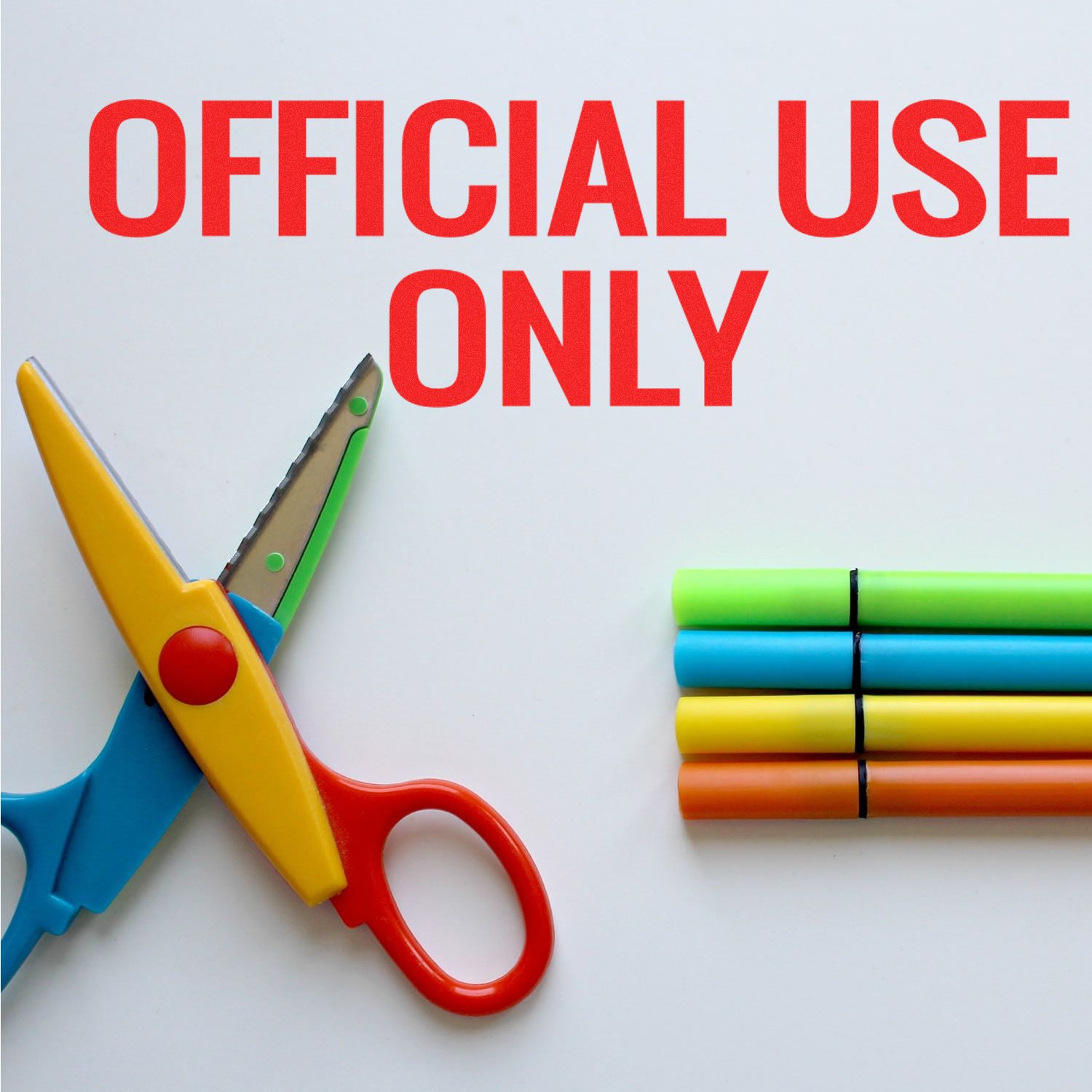 Large Pre-Inked Official Use Only Stamp in red text on white background, next to colorful scissors and four markers.