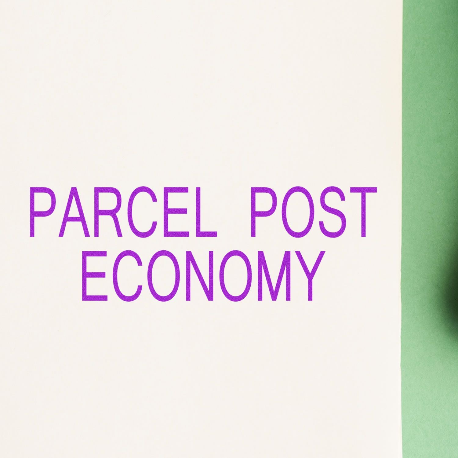 Image of a Large Pre-Inked Parcel Post Economy Stamp imprint in purple ink on white paper with a green background on the right side.