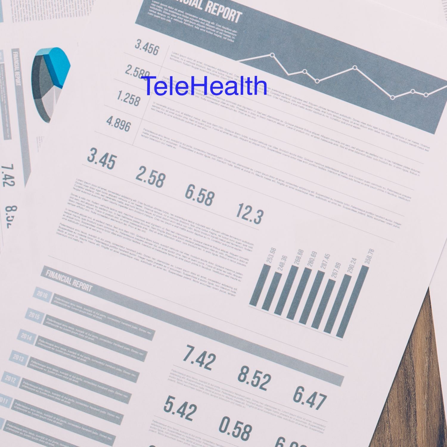 Financial reports on a desk with a Large Pre-Inked Telehealth Stamp marking 'TeleHealth' in blue ink on one of the documents.