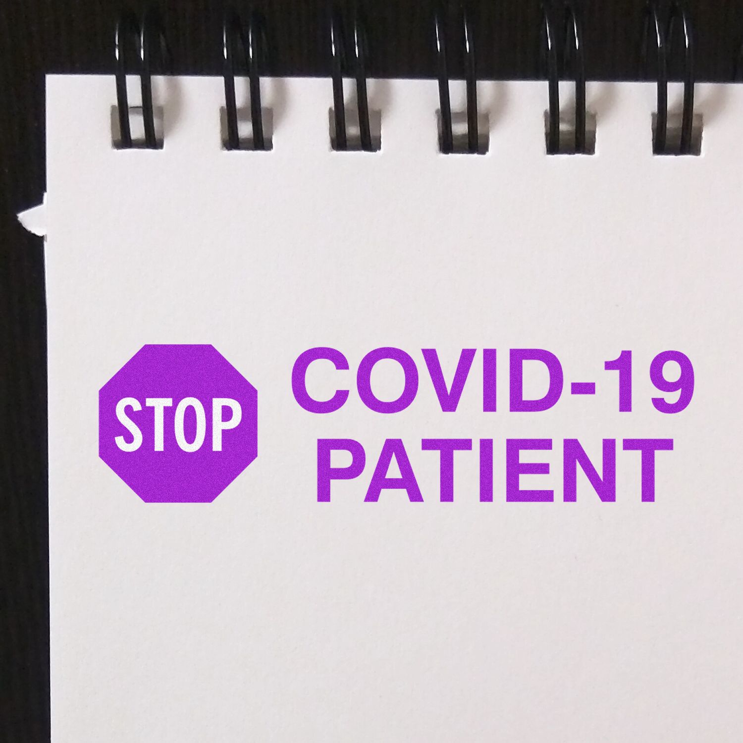 Image of a Large Self Inking Stop Covid Patient Stamp imprint on white paper, featuring a purple stop sign and the text COVID-19 PATIENT .