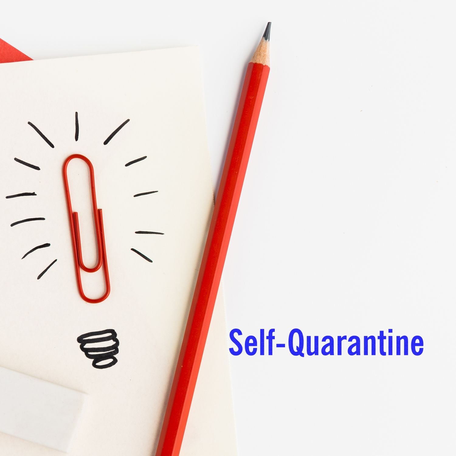 Red pencil and paperclip on paper with Self-Quarantine text. Large Self Inking Self-Quarantine Stamp product not shown in image.