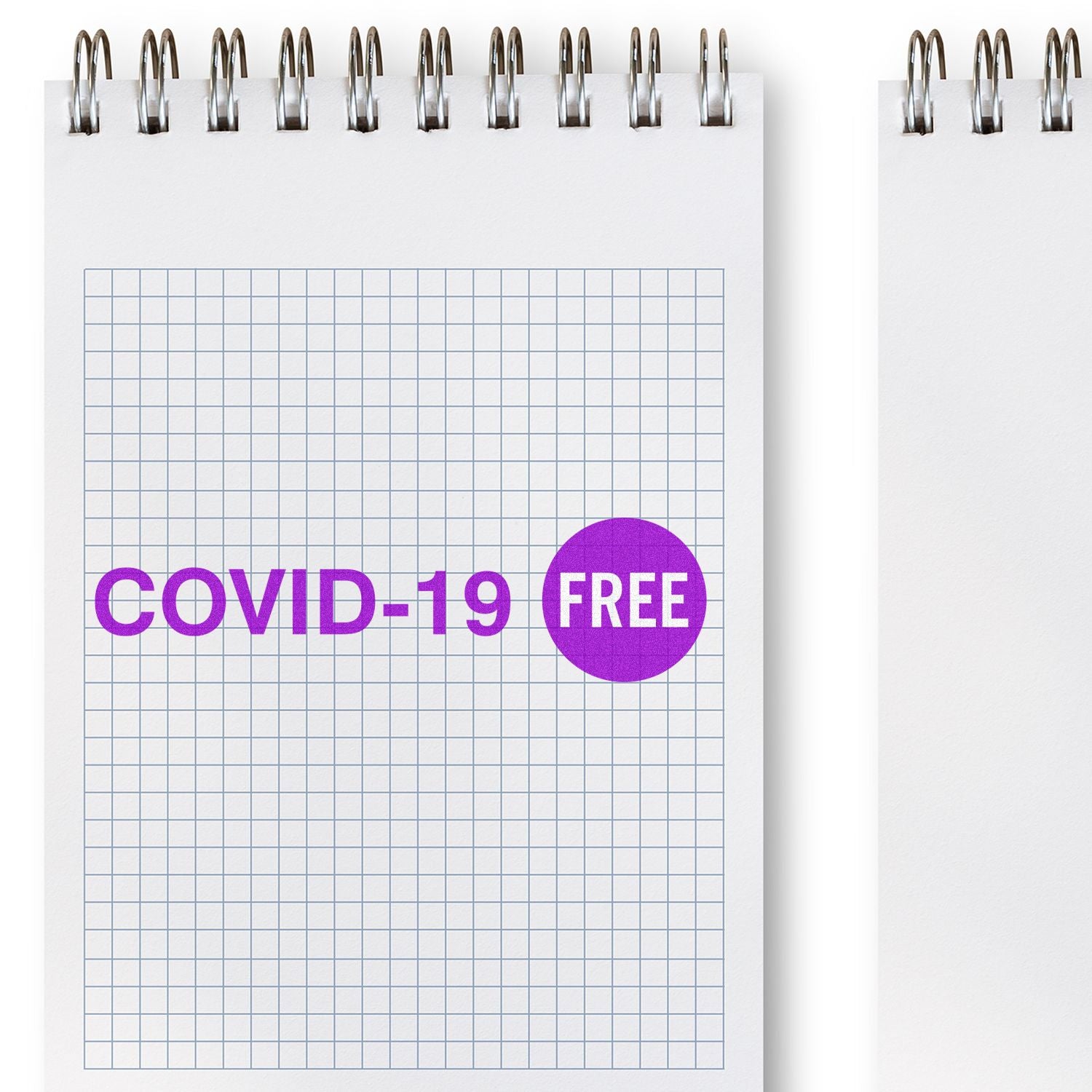 Large Self Inking Covid-19 Stamp in purple ink on a grid notebook page, displaying COVID-19 FREE in bold letters.