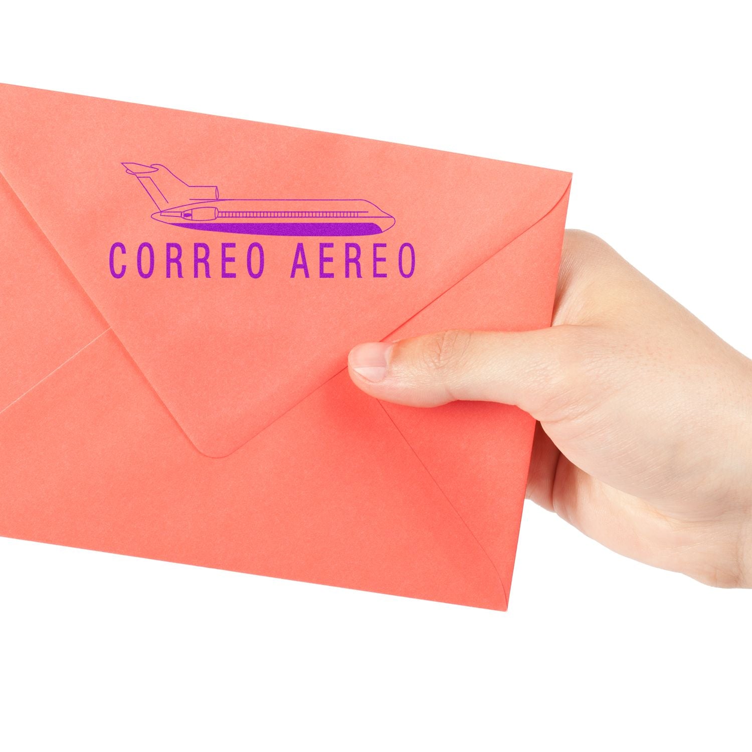 Hand holding a red envelope stamped with the Large Self Inking Correo Aero Stamp, featuring a purple airplane and text CORREO AEREO .