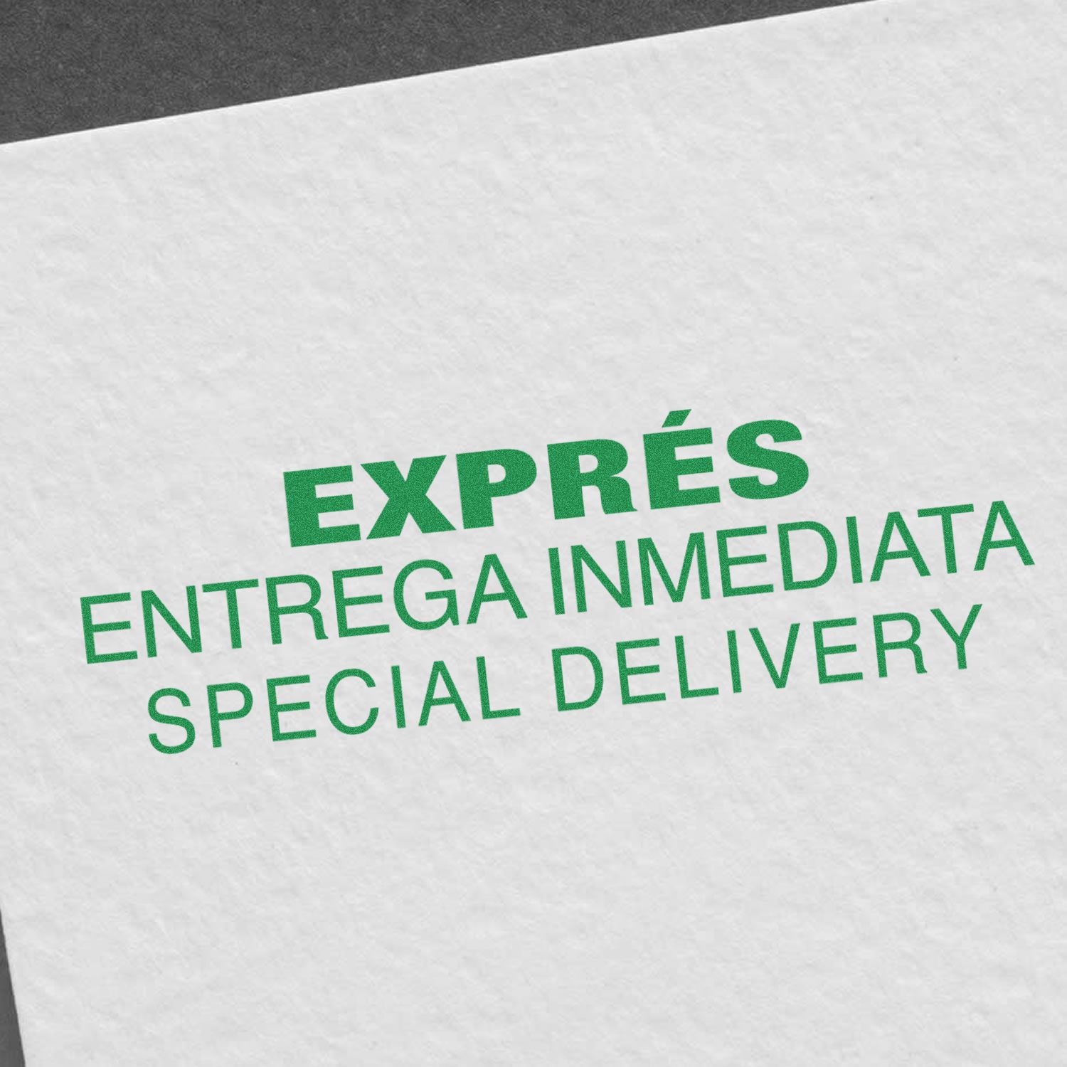 Image of a white paper stamped with green ink reading EXPRÉS ENTREGA INMEDIATA SPECIAL DELIVERY using the Large Self Inking Expres Entrega Inmedia Stamp.