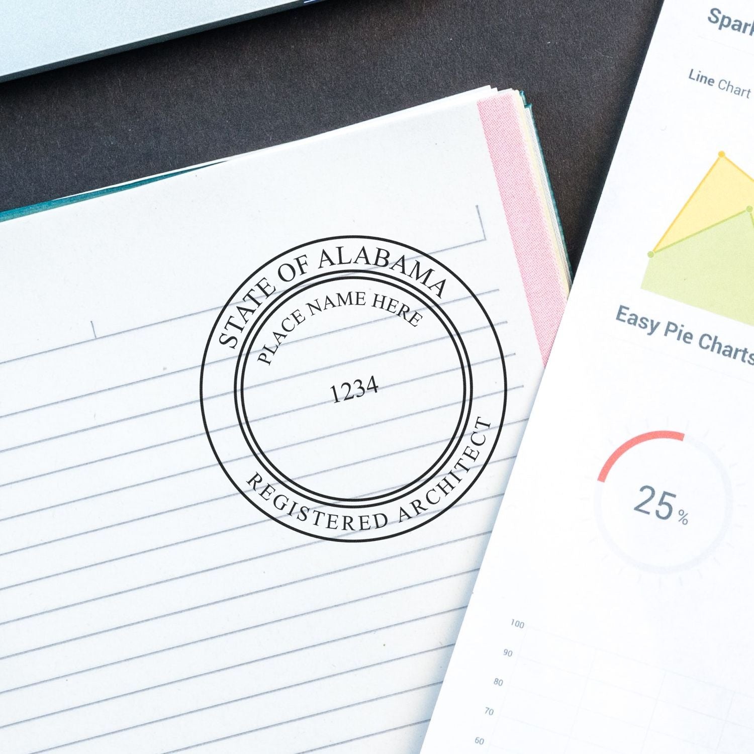 Alabama Architect Seal Stamp on a lined notebook page next to a chart document, showing the official seal for registered architects in Alabama.