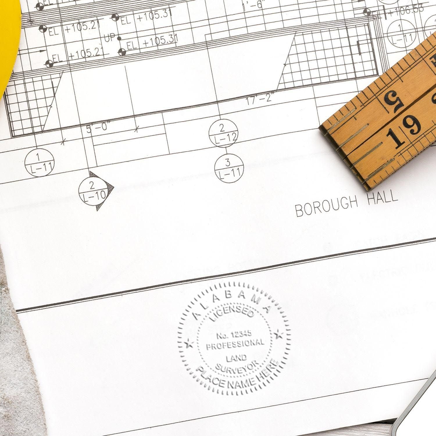 An alternative view of the Gift Alabama Land Surveyor Seal stamped on a sheet of paper showing the image in use