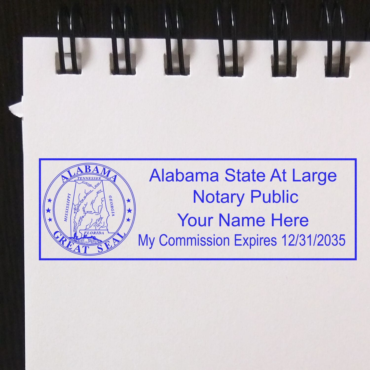 A stamped impression of the Self-Inking State Seal Alabama Notary Stamp in this stylish lifestyle photo, setting the tone for a unique and personalized product.