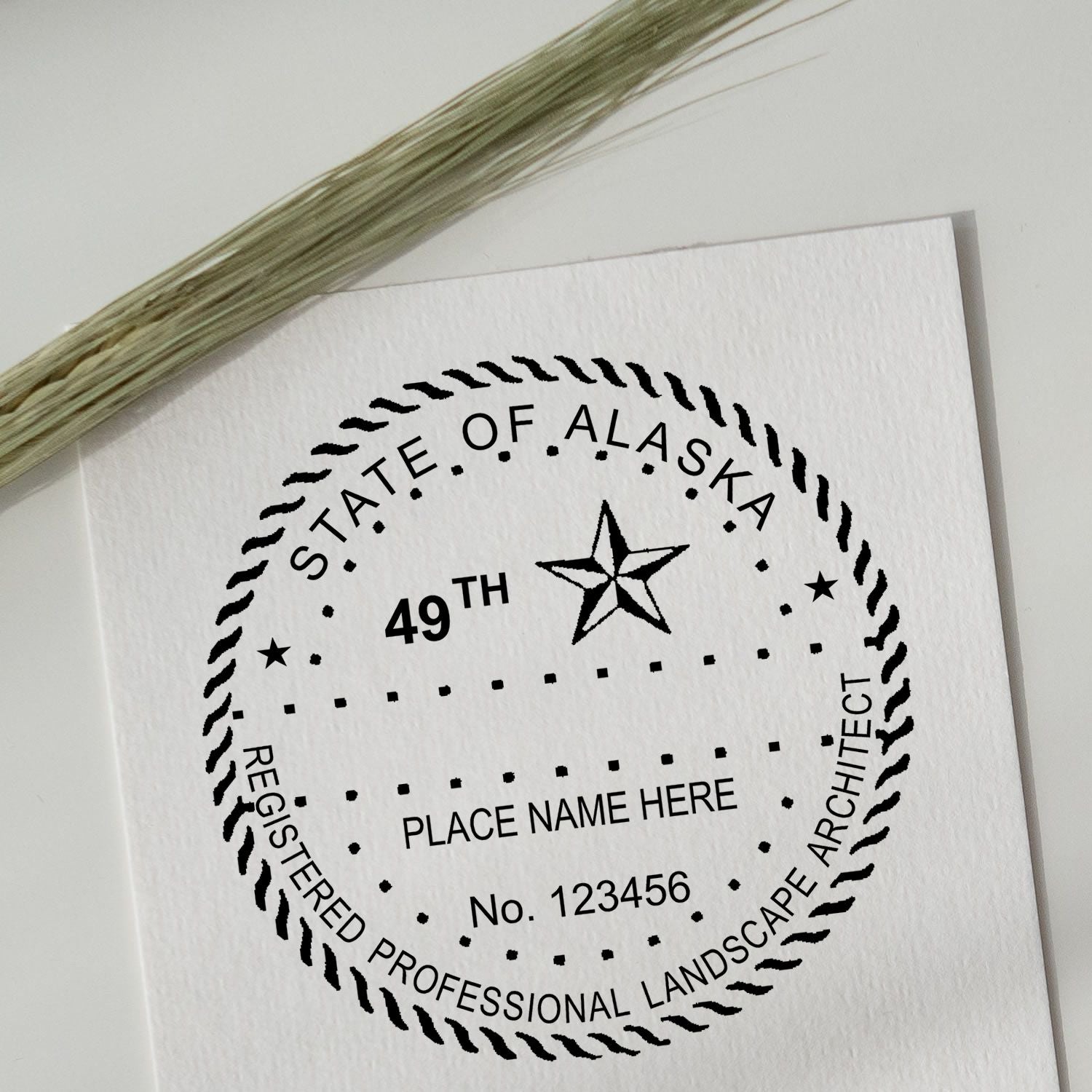 This paper is stamped with a sample imprint of the Slim Pre-Inked Alaska Landscape Architect Seal Stamp, signifying its quality and reliability.