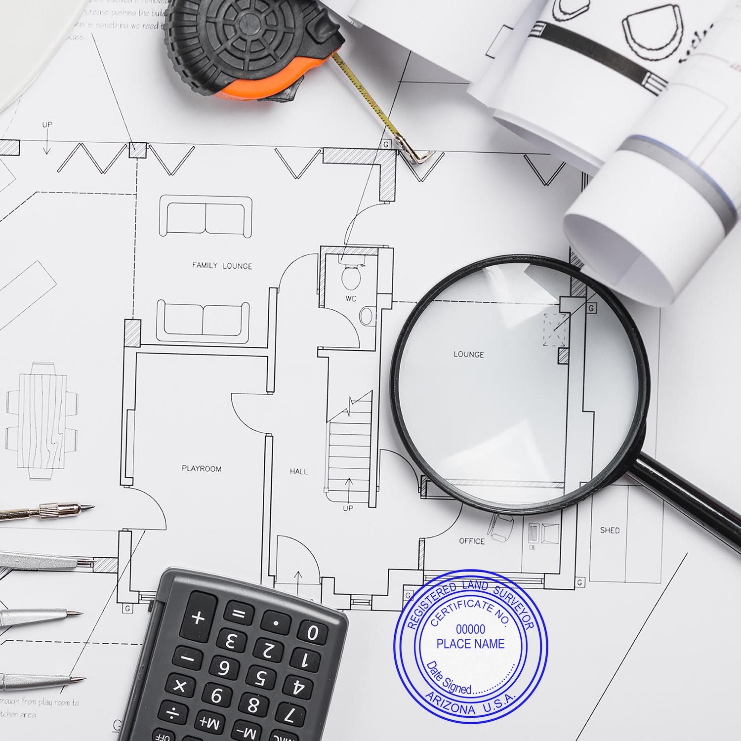 Arizona Land Surveyor Seal Stamp, AZ PLS Stamp, on architectural blueprints with a magnifying glass, calculator, and measuring tape.