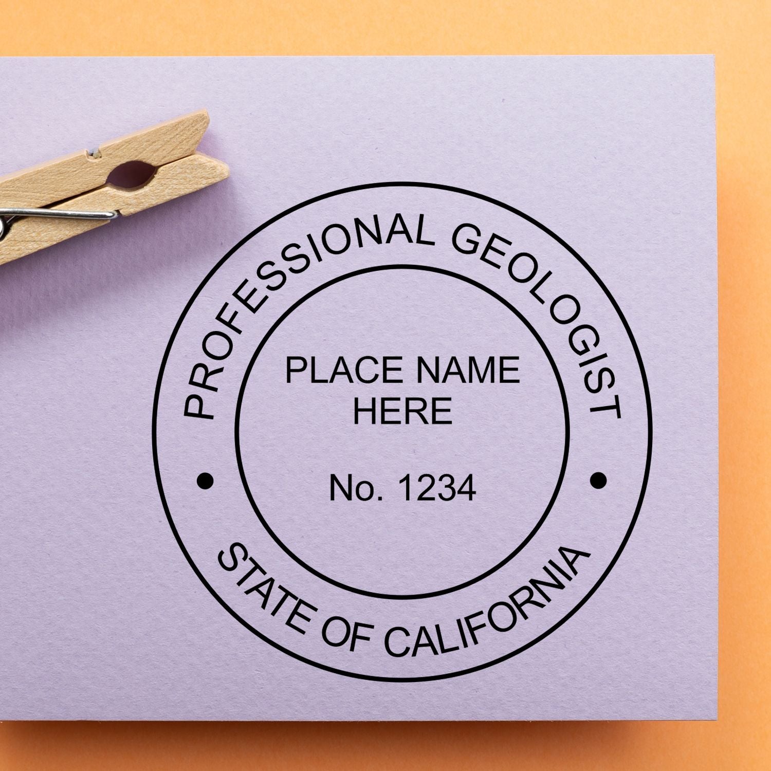 A lifestyle photo showing a stamped image of the Slim Pre-Inked California Professional Geologist Seal Stamp on a piece of paper