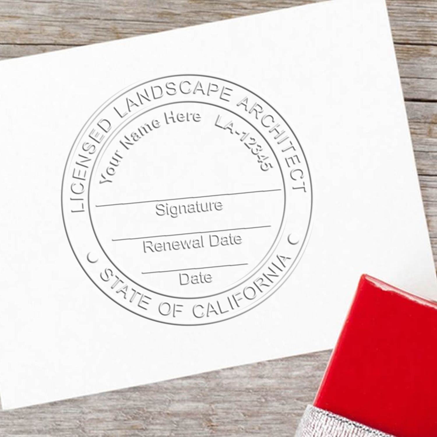 A stamped impression of the State of California Handheld Landscape Architect Seal in this stylish lifestyle photo, setting the tone for a unique and personalized product.