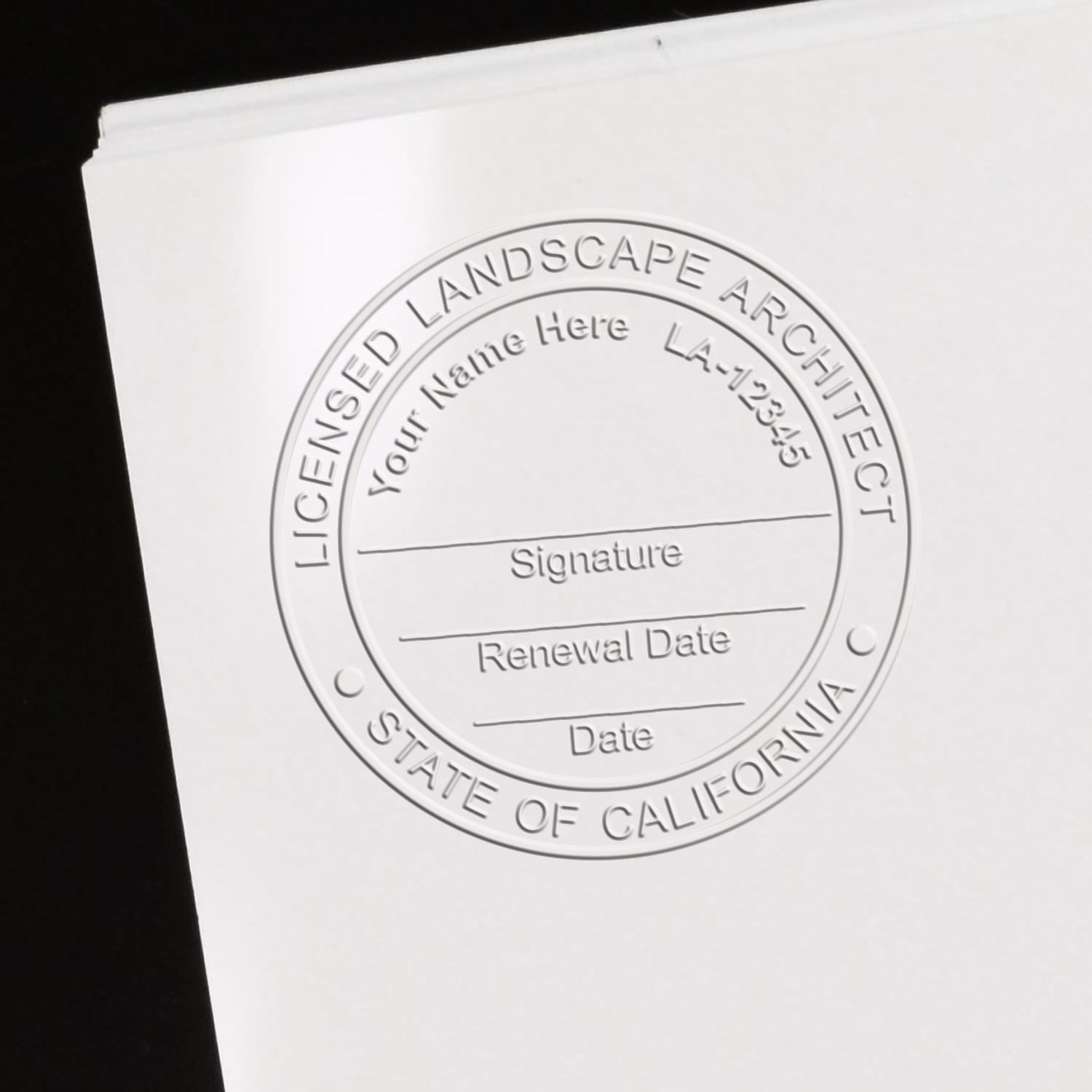 A stamped impression of the California Desk Landscape Architectural Seal Embosser in this stylish lifestyle photo, setting the tone for a unique and personalized product.