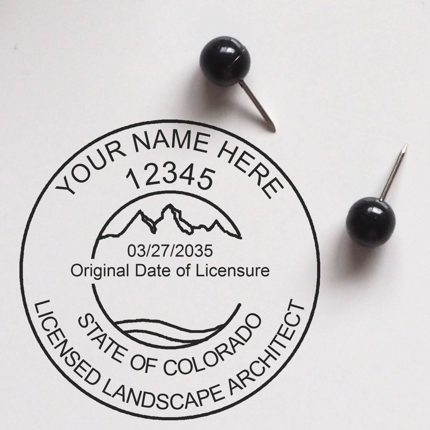 A stamped impression of the Self-Inking Colorado Landscape Architect Stamp in this stylish lifestyle photo, setting the tone for a unique and personalized product.