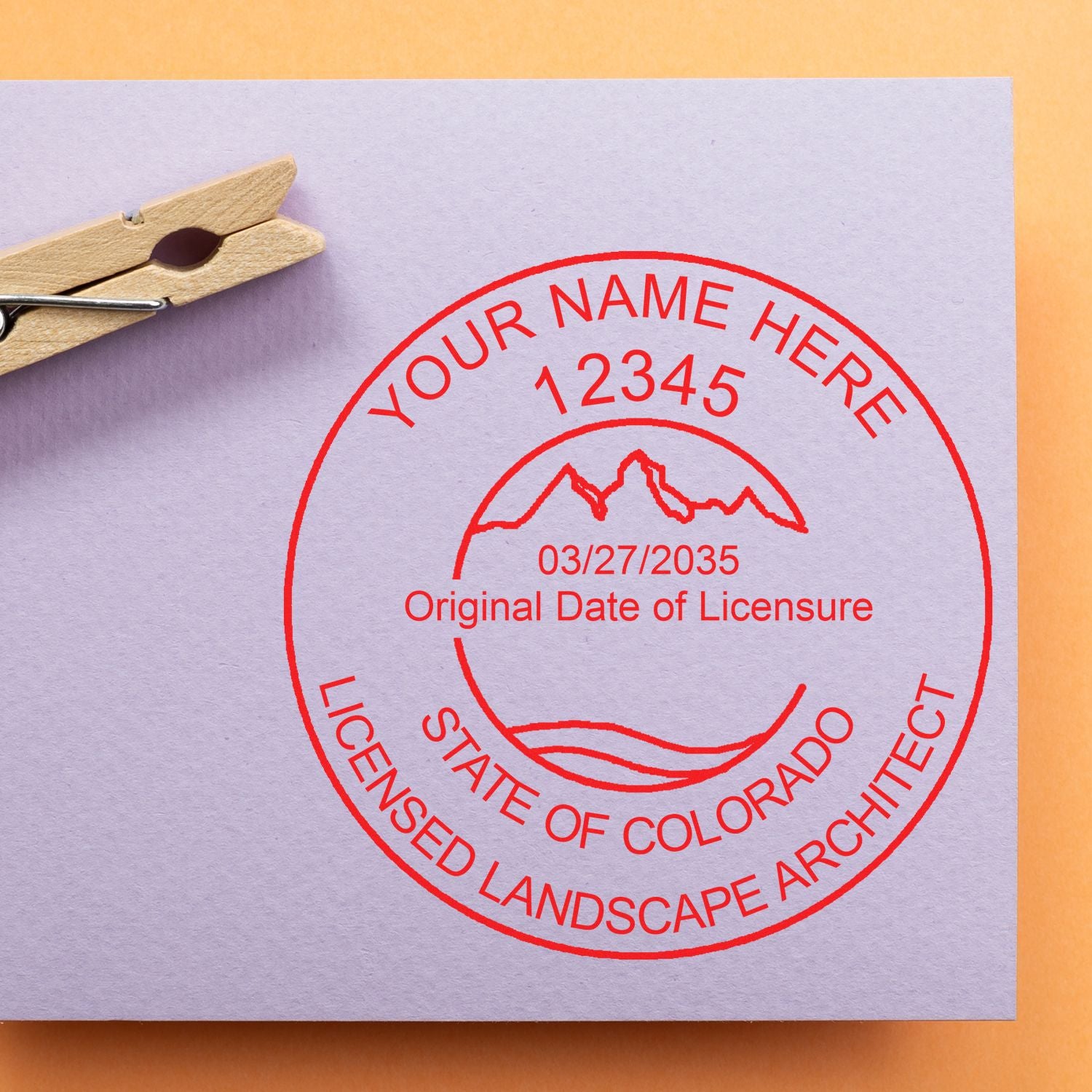 A stamped impression of the Self-Inking Colorado Landscape Architect Stamp in this stylish lifestyle photo, setting the tone for a unique and personalized product.