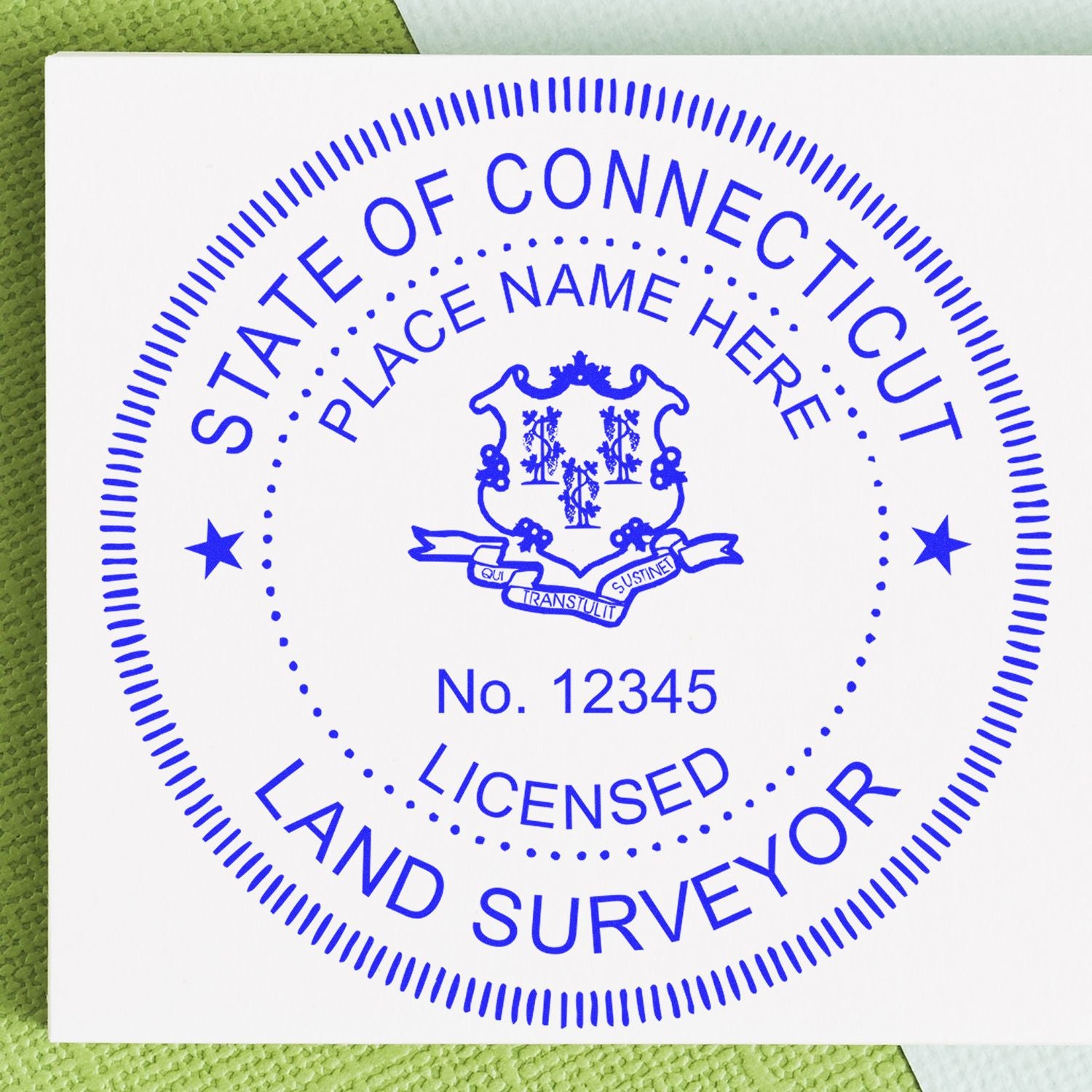 Self Inking Connecticut Land Surveyor Stamp with blue ink imprint on white paper, featuring state seal and customizable text fields.