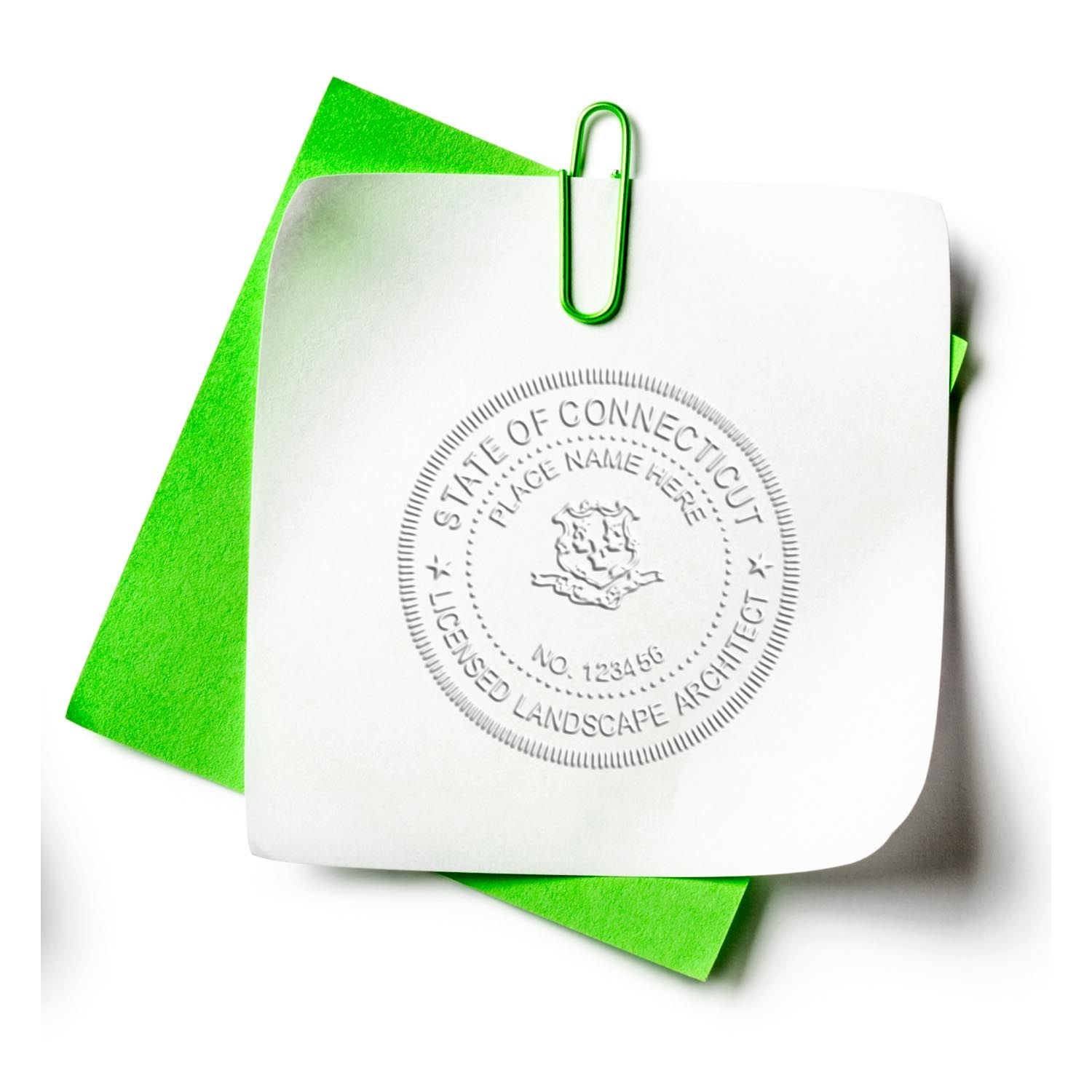 A lifestyle photo showing a stamped image of the State of Connecticut Extended Long Reach Landscape Architect Seal Embosser on a piece of paper