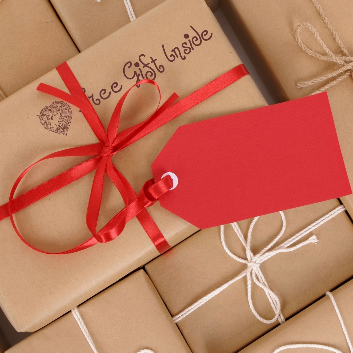 Brown gift boxes with red and white ribbons, stamped with Free Gift Inside using Custom Self Inking Stamp Trodat 4915 Size 1 x 2-3/4.