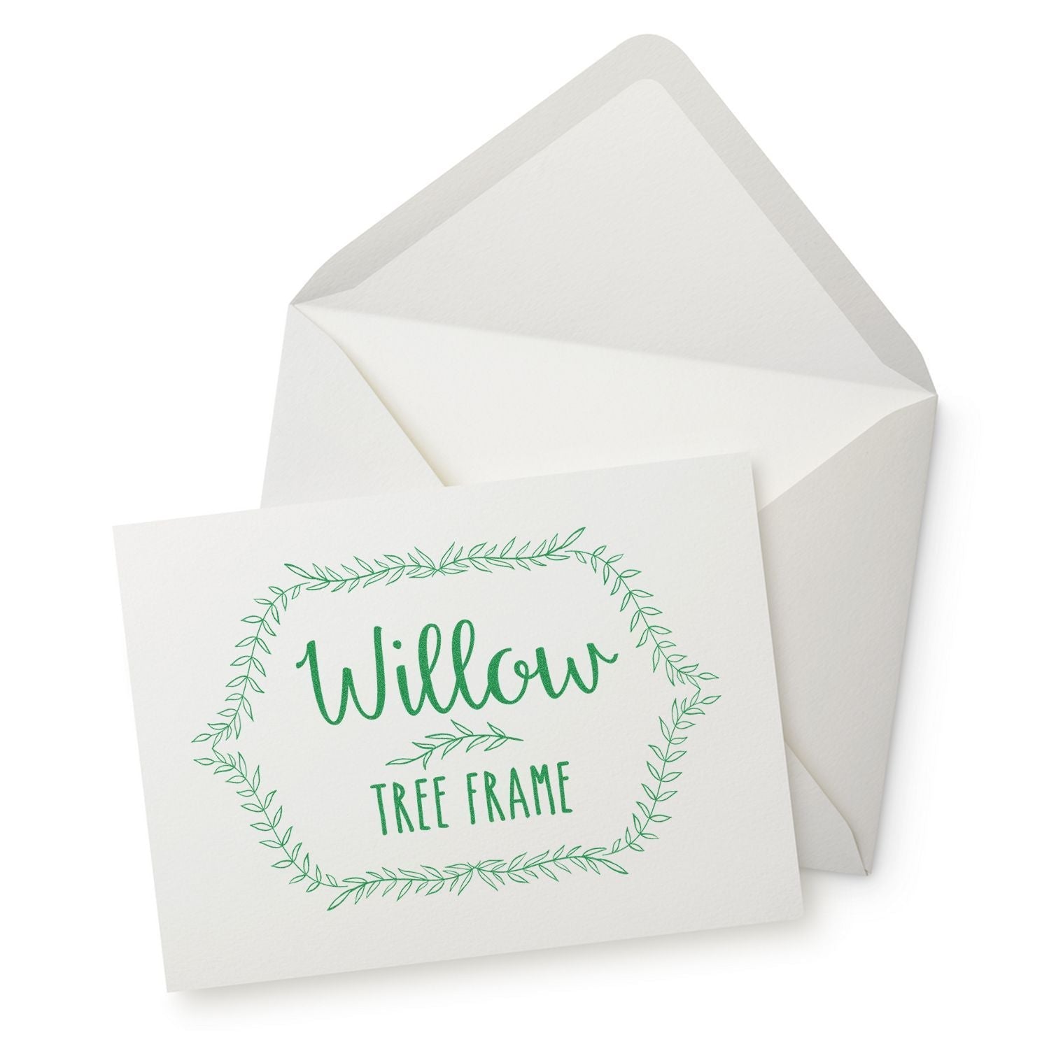 A greeting card with Willow Tree Frame text and a leafy border, next to an envelope. MaxLight XL2-700 Custom Pre-Inked Business Stamp 2-3/4-x 3-3/4 in use.