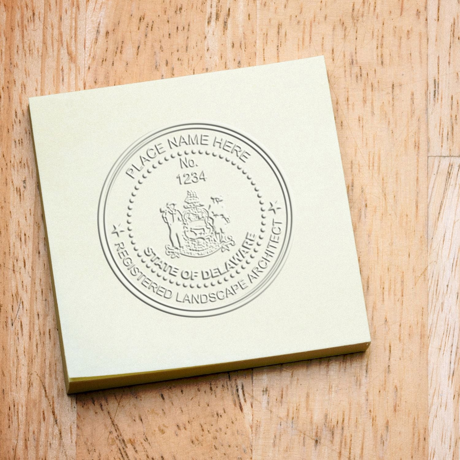 State of Delaware Handheld Landscape Architect Seal in use photo showing a stamped imprint of the State of Delaware Handheld Landscape Architect Seal