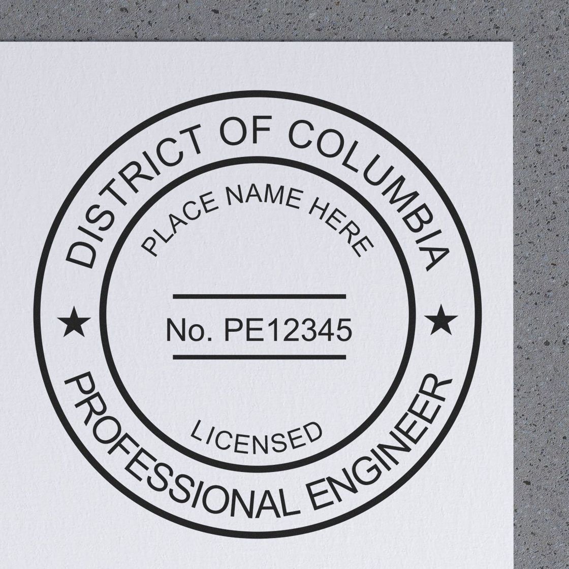 A lifestyle photo showing a stamped image of the District of Columbia Professional Engineer Seal Stamp on a piece of paper