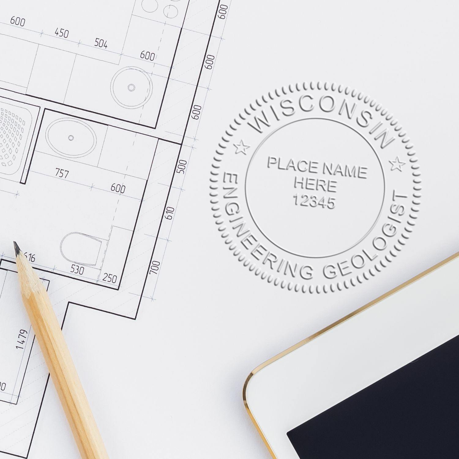 Engineering Geologist Hybrid Seal Embosser imprint on a technical drawing, with a pencil and a smartphone nearby.