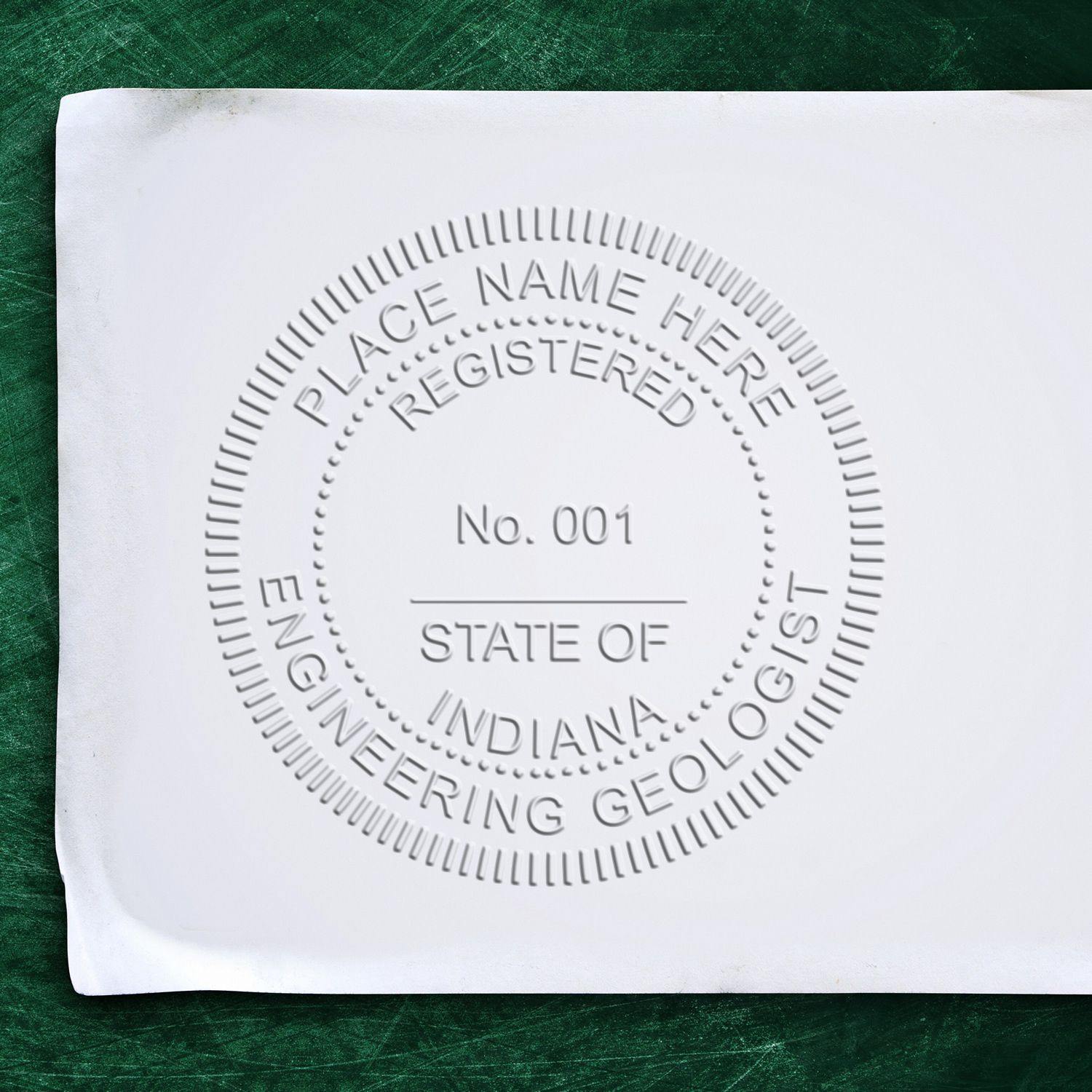 Image of an embossed seal on white paper with the text PLACE NAME HERE, REGISTERED, No. 001, STATE OF INDIANA, ENGINEERING GEOLOGIST created using the Engineering Geologist Hybrid Seal Embosser.