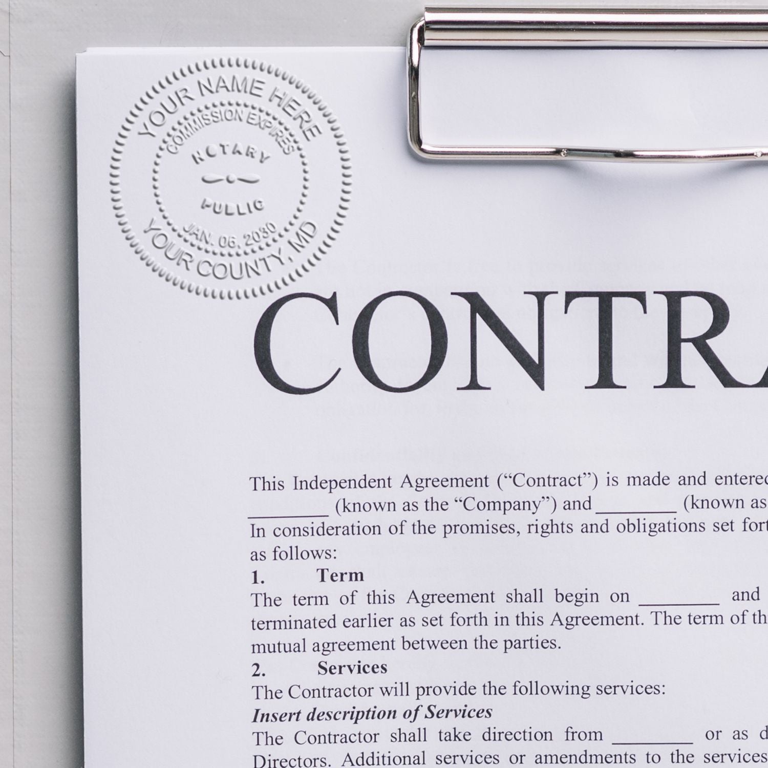 Handheld Notary Seal Embosser in use, creating a raised notary seal on a contract document clipped to a clipboard.