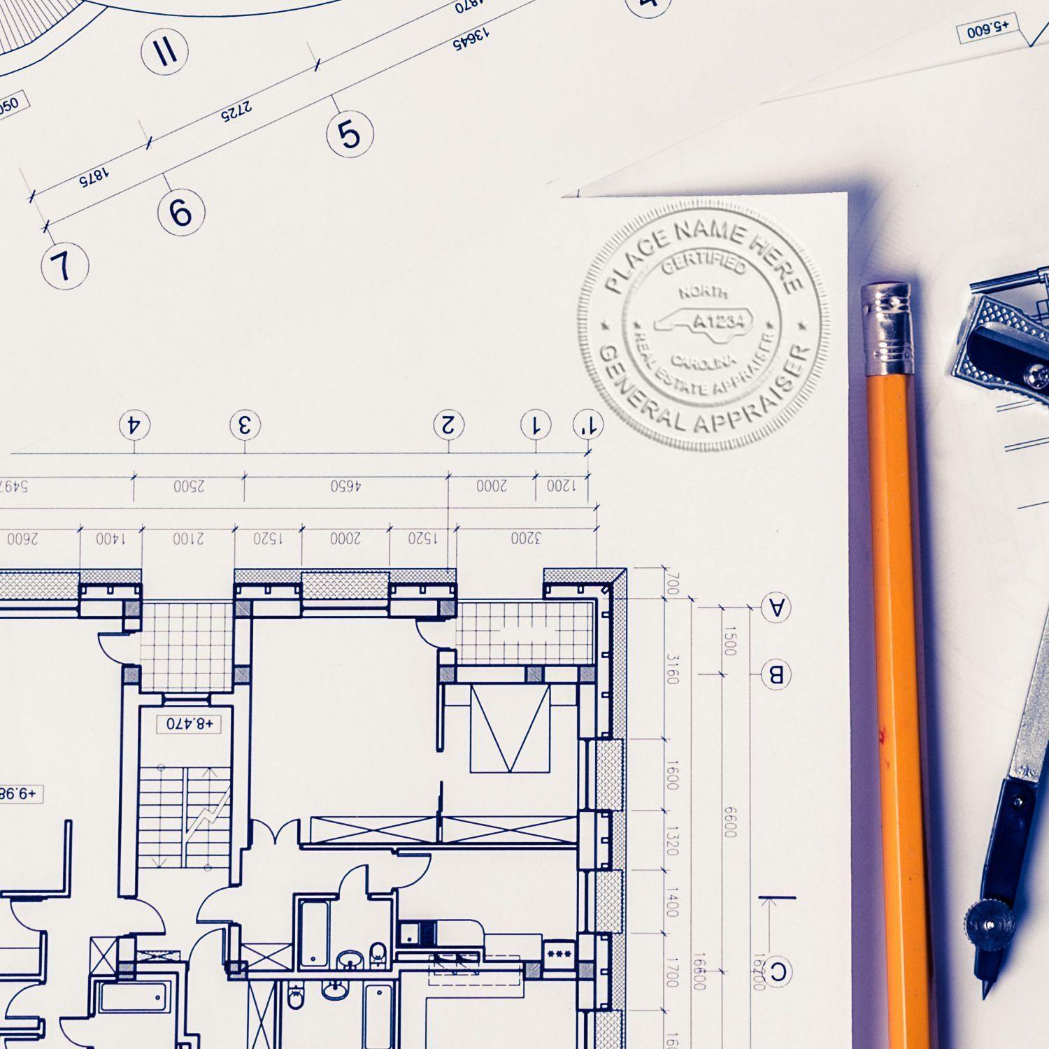 Blueprints with an embossed seal from the Real Estate Appraiser Pink Soft Seal Embosser, alongside a pencil and drafting tools.