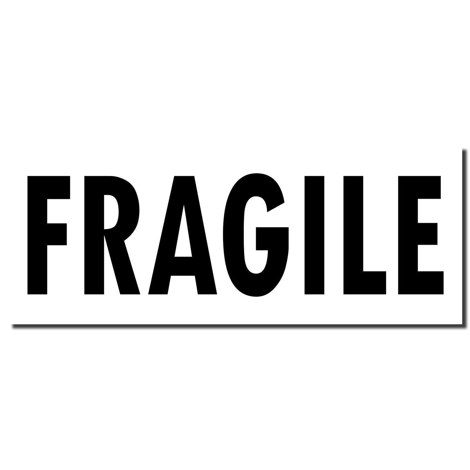 Large Self Inking Fragile Stamp imprint in bold black letters on a white background, indicating the word FRAGILE for package labeling.