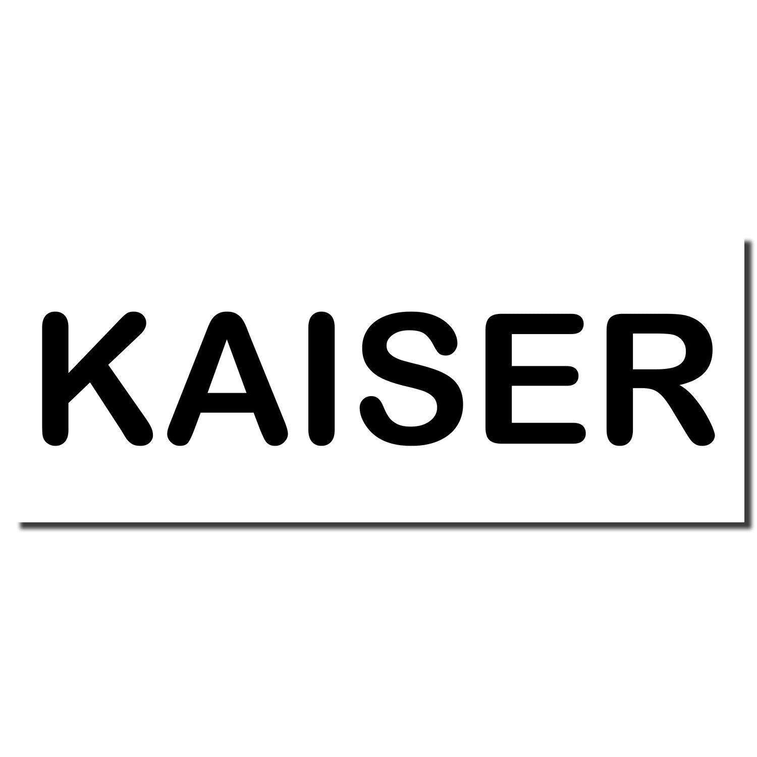 Black imprint of the word 'KAISER' from a Slim Pre-Inked Kaiser Stamp on a white background.