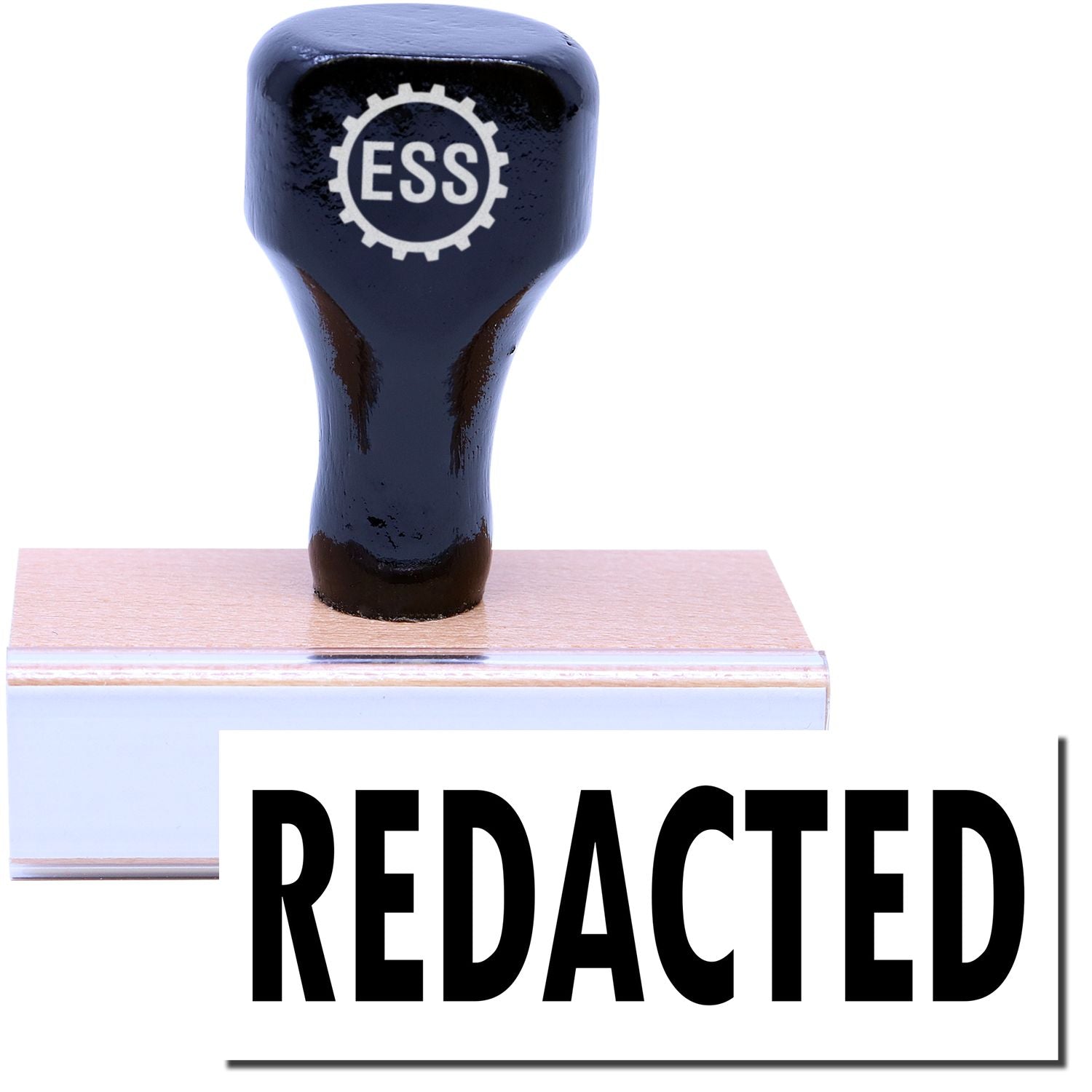 A stock office rubber stamp with a stamped image showing how the text REDACTED is displayed after stamping.