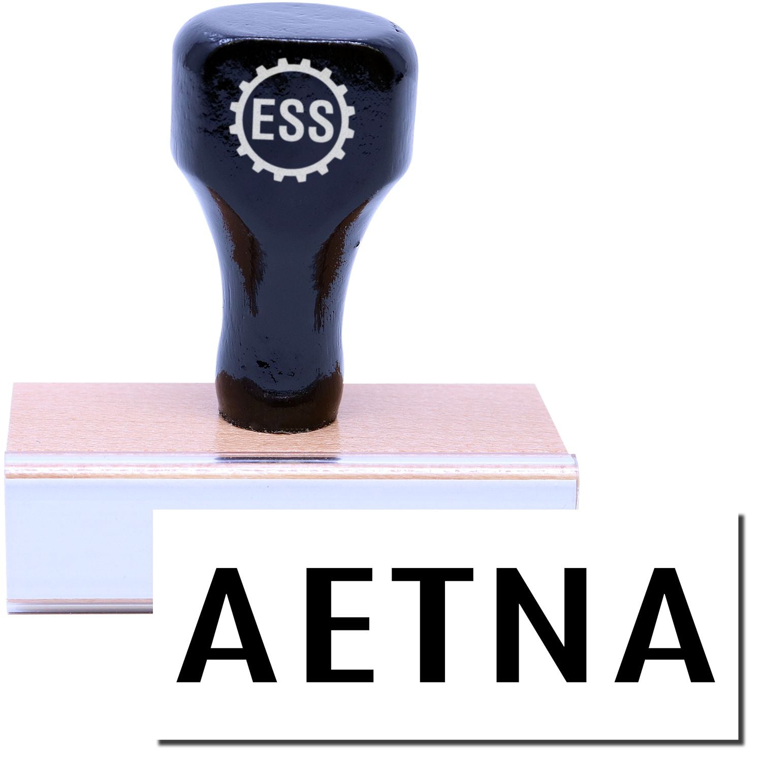 A stock office medical rubber stamp with a stamped image showing how the text AETNA is displayed after stamping.