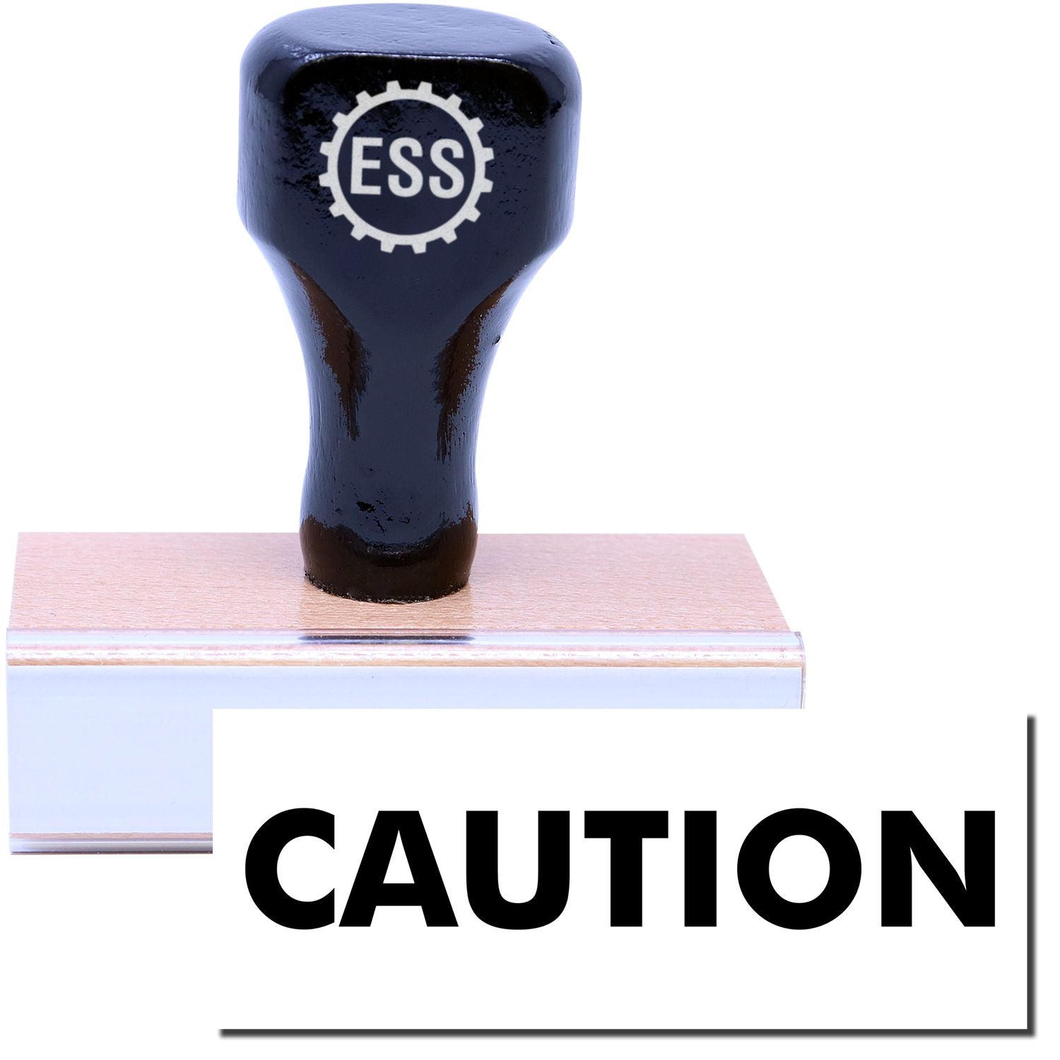 A stock office rubber stamp with a stamped image showing how the text CAUTION is displayed after stamping.