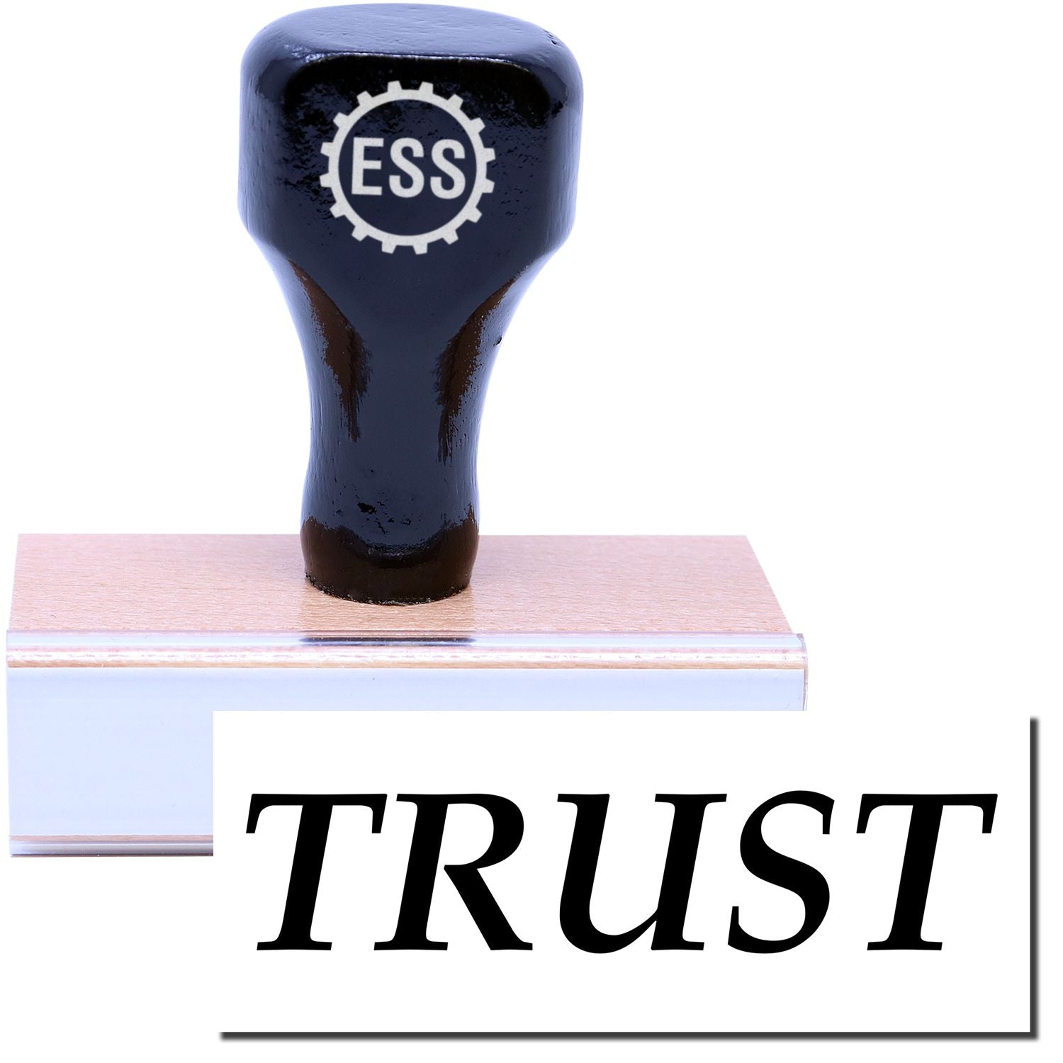 A stock office rubber stamp with a stamped image showing how the text TRUST is displayed after stamping.