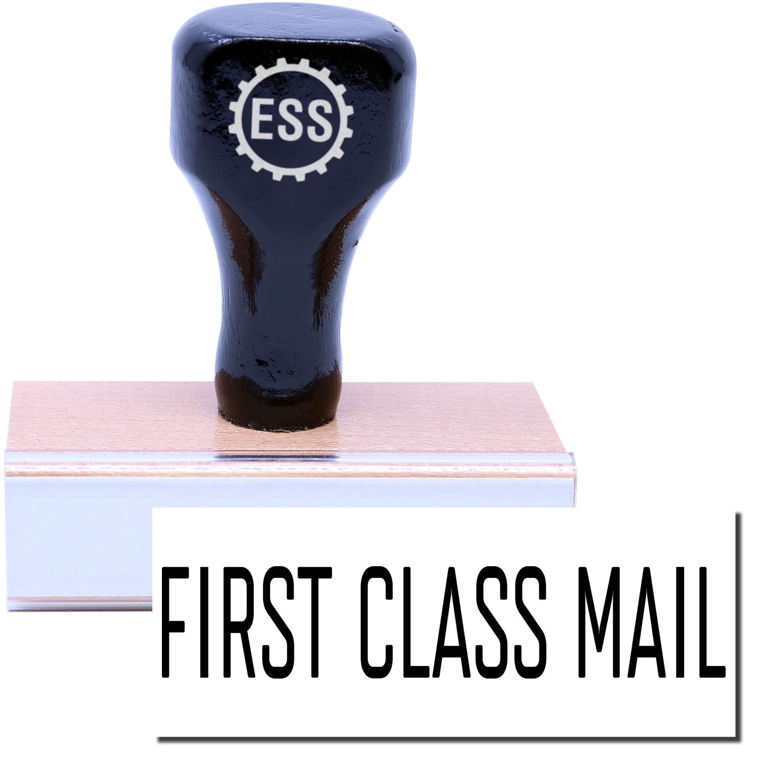 A stock office rubber stamp with a stamped image showing how the text FIRST CLASS MAIL in a narrow font is displayed after stamping.