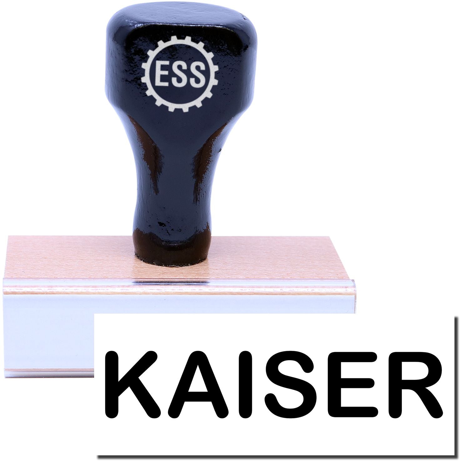 A stock office rubber stamp with a stamped image showing how the text KAISER in a large font is displayed after stamping.