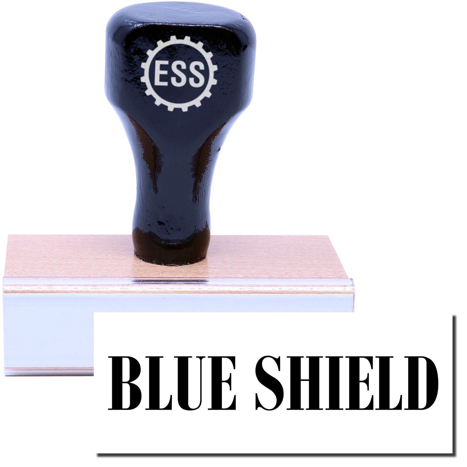 A stock office rubber stamp with a stamped image showing how the text BLUE SHIELD in a large font is displayed after stamping.