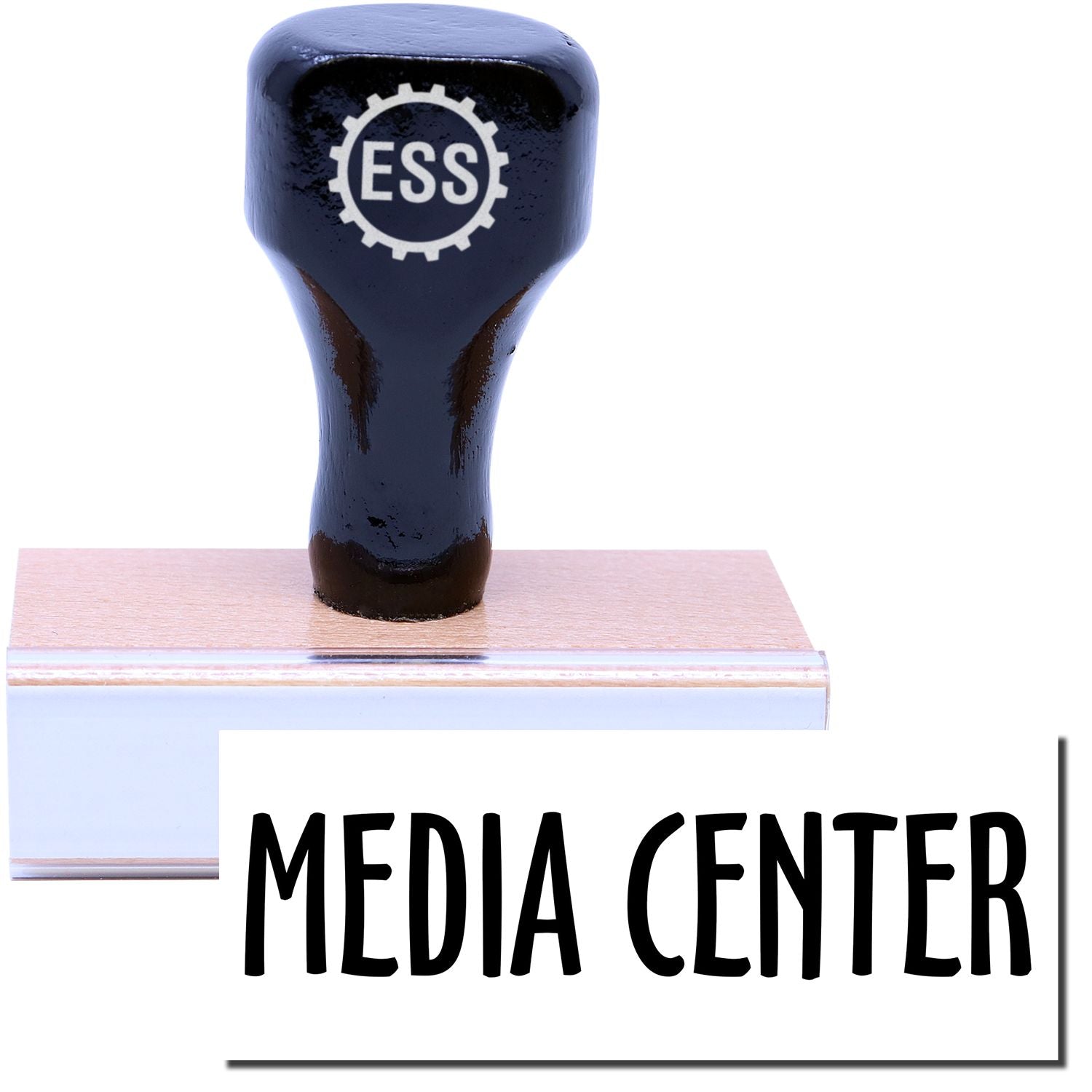 A stock office rubber stamp with a stamped image showing how the text MEDIA CENTER in a large font is displayed after stamping.