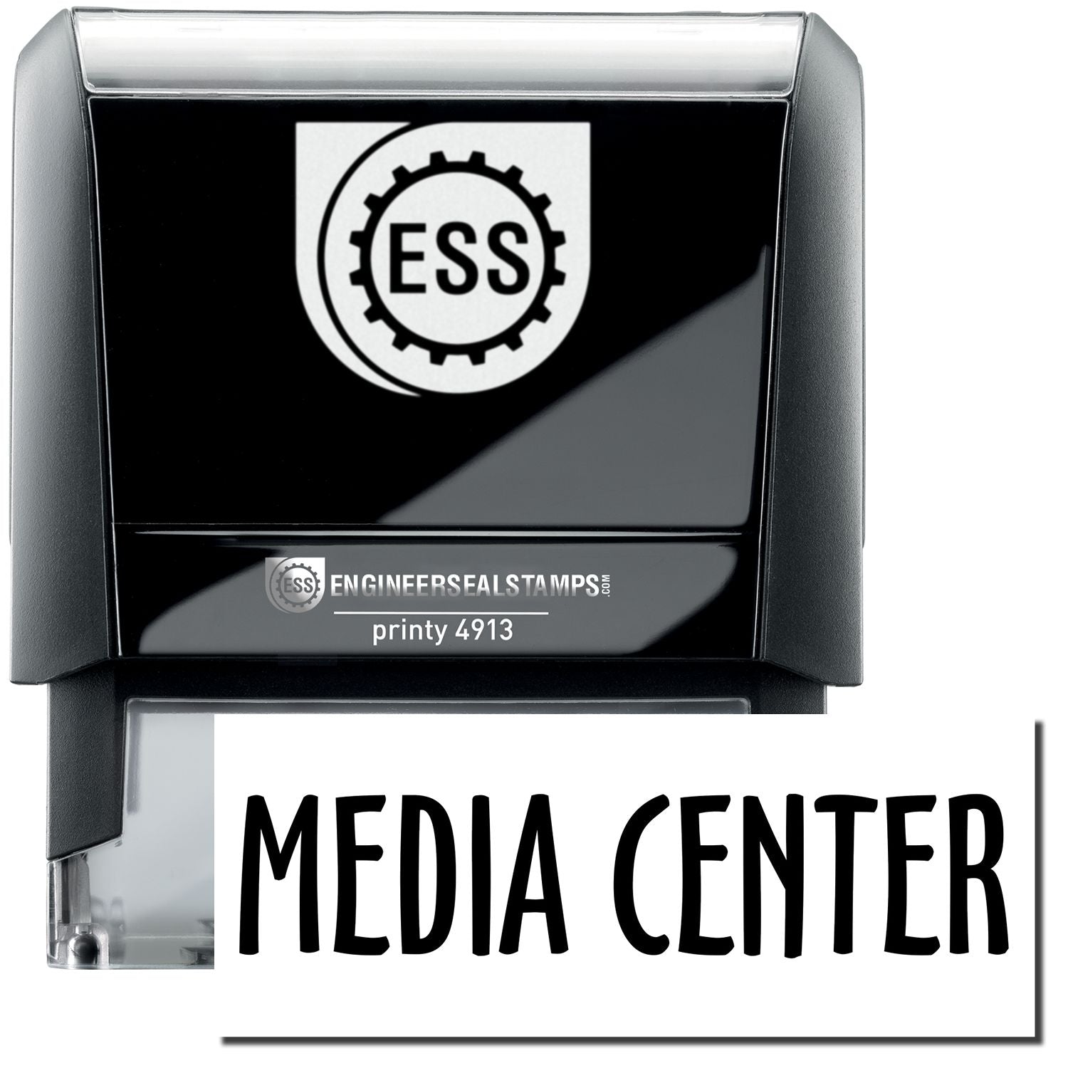 A self-inking stamp with a stamped image showing how the text MEDIA CENTER in a large bold font is displayed by it.